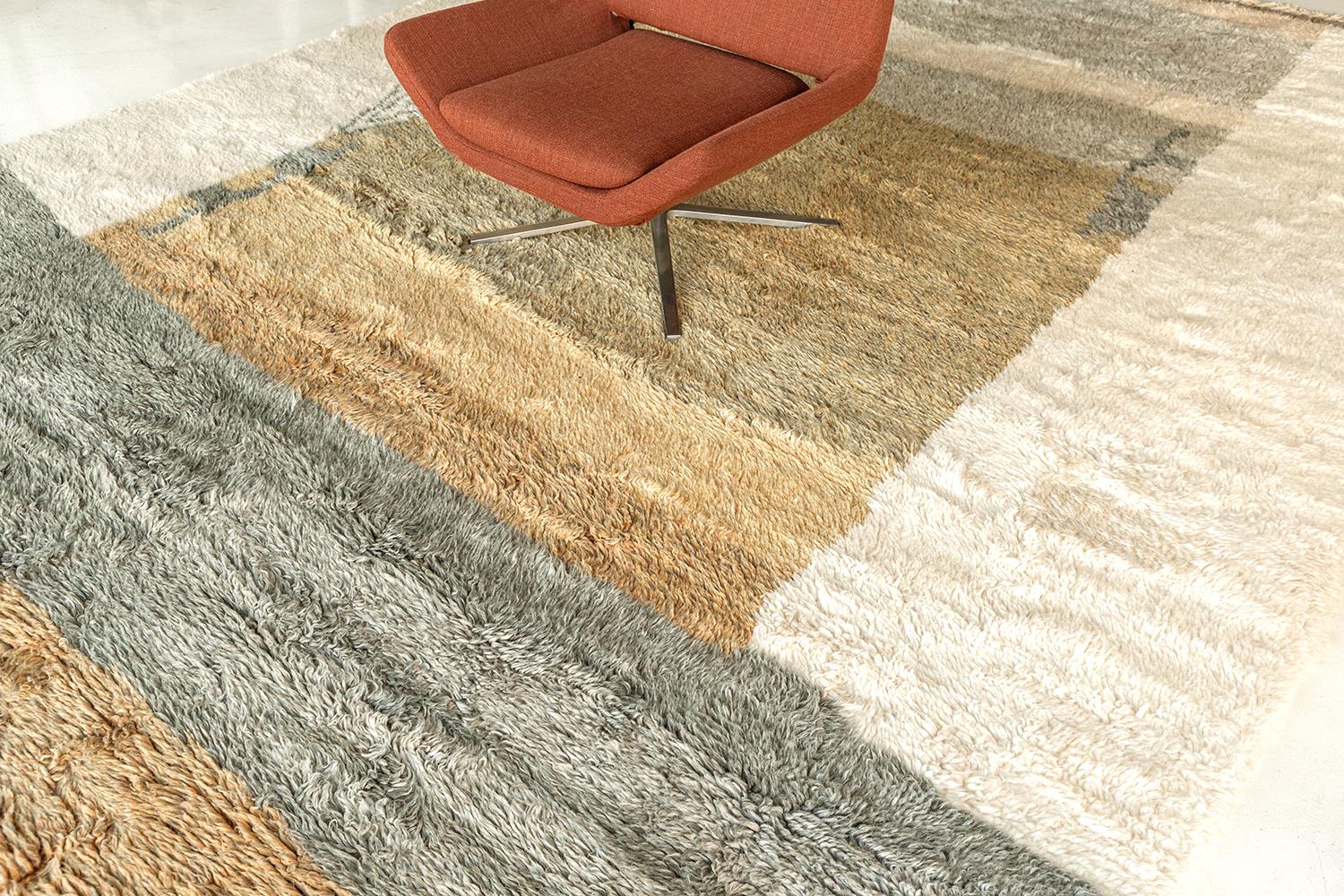 'Jorja' is a breathtaking rug inspired by the Atlas Mountains of Morocco. This magnificent rug features earth toned colors and irregular shapes and design elements work cohesively to make for a great contemporary interpretation for the modern design