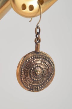 Jorma Laine, Finland. Pair of bronze earrings with ornamental relief design.
