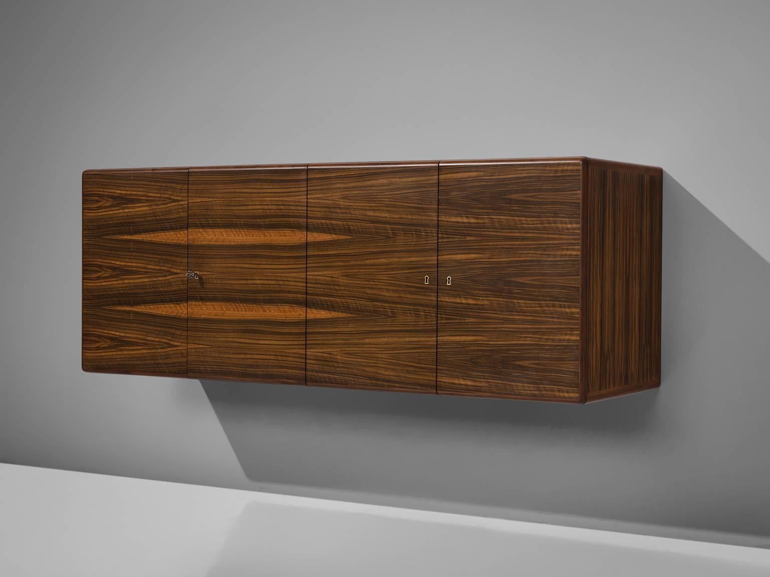 Jos De Mey for Van den Berghe-Pouvers, rosewood, Belgium, 1960s. 

This modern and Minimalist wall-mounted credenza is designed by Belgium designer Jos De Mey and produced by Van den Berghe-Pouvers. This four-door cabinet features a beautifully