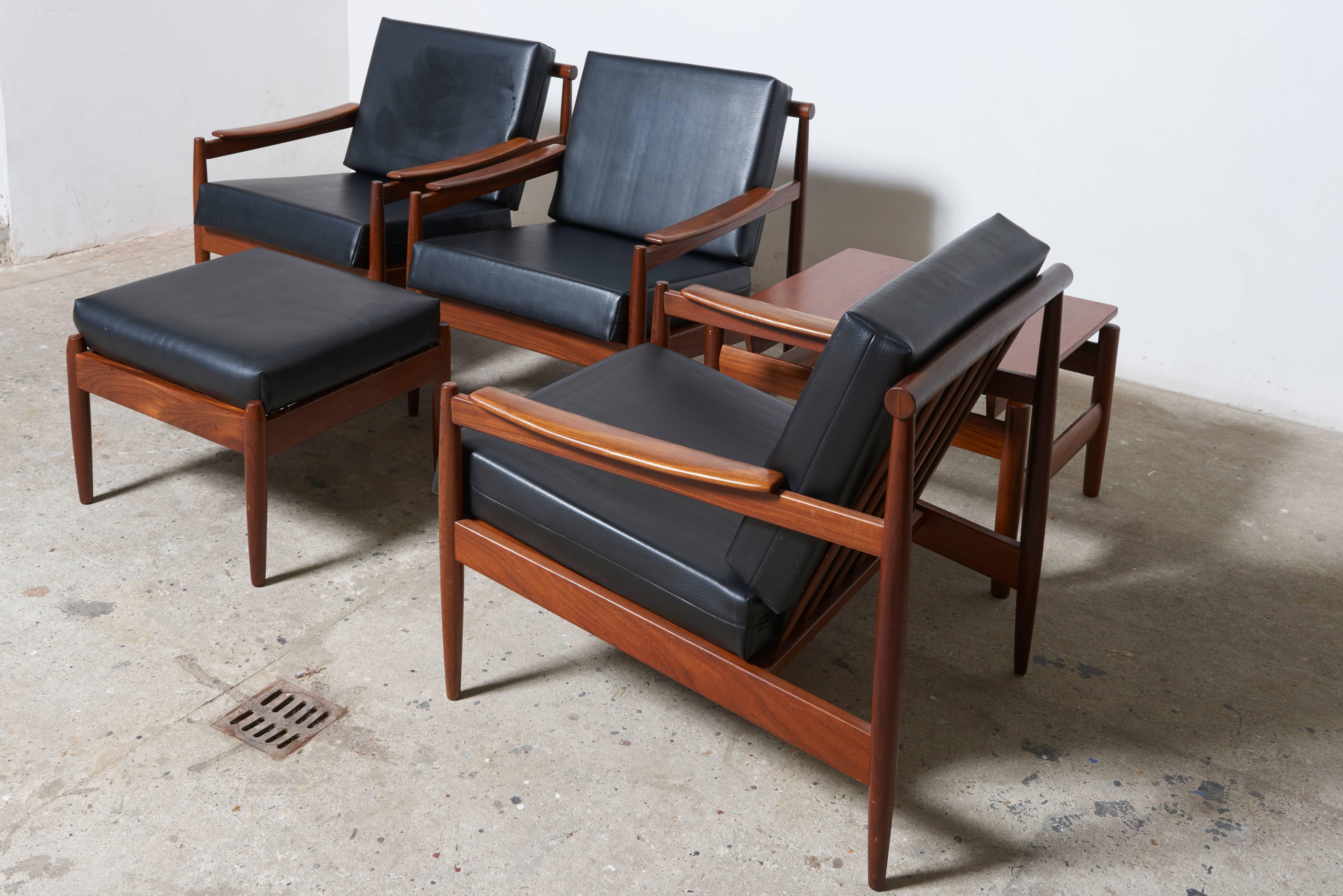 Beautiful set of two easy chairs, one easy chair with footstool and one side, coffee table designed under a fine Japanese influence in the 1960s, the fineness and style makes this set unique in its genre designed by Jos De Mey and manufactured in