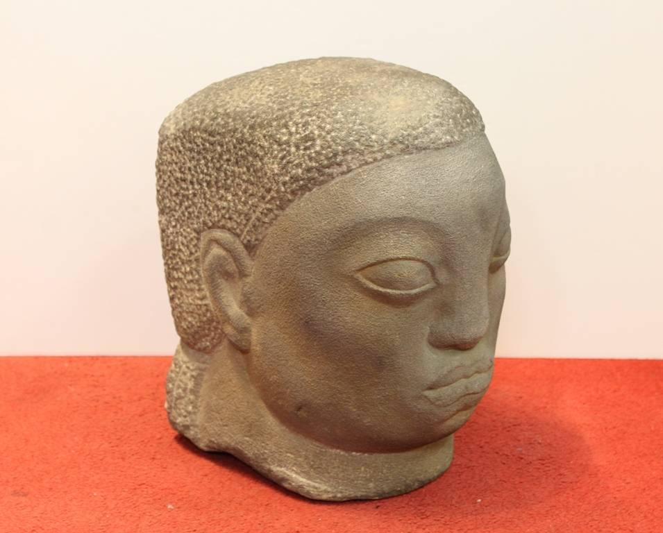A carved grey stone head sculpture, made by Spanish-born American artist Jose de Creeft in the 1930s-1940s in the Mexican School style. The piece is in excellent condition. Unsigned.