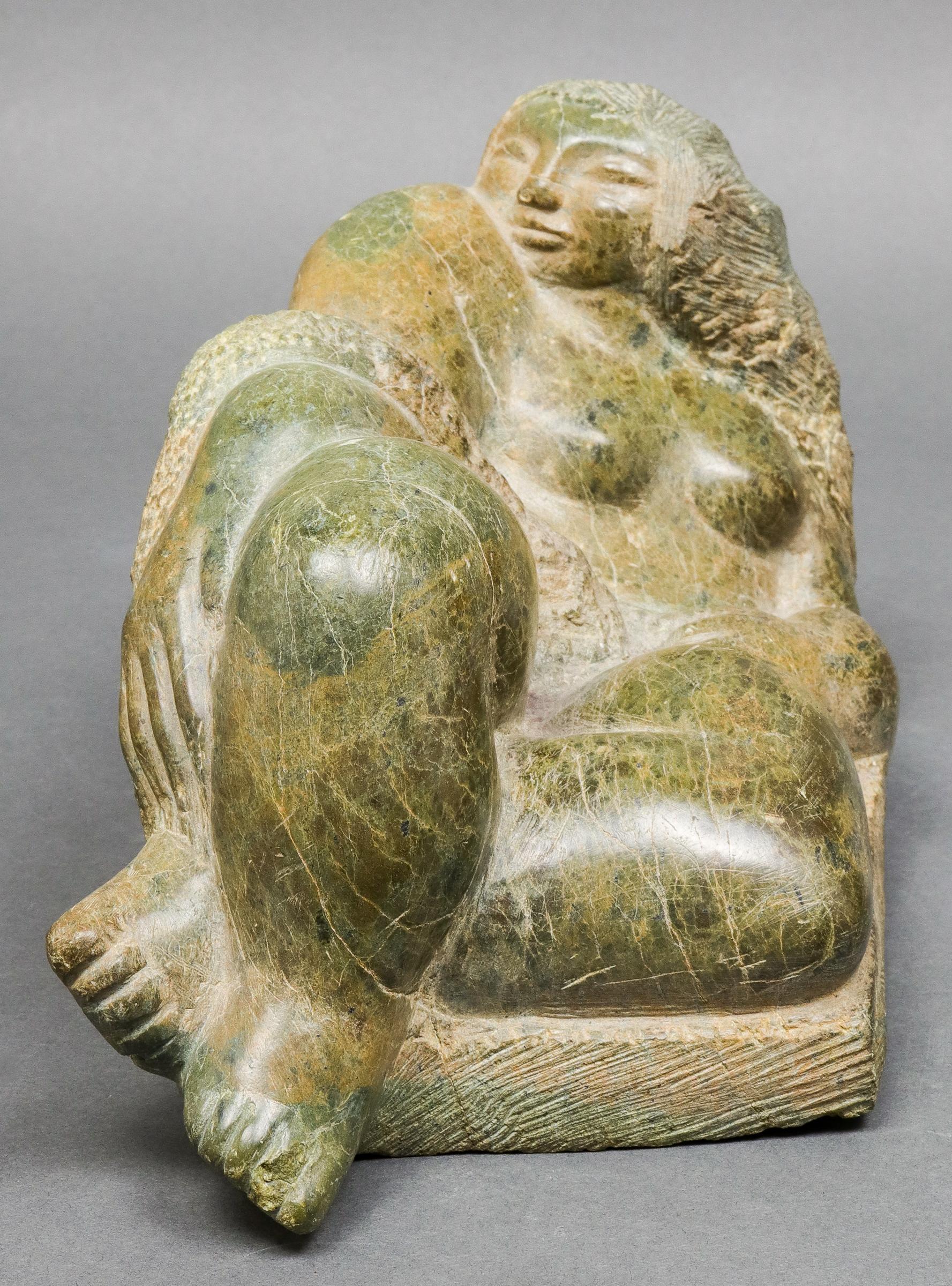 Modern sculpture of a reclining female nude carved in green serpentine stone, made by Spanish-born American artist José Mariano de Creeft, (1884-1982). The piece is unsigned and remains in remarkable vintage condition with age-appropriate wear and