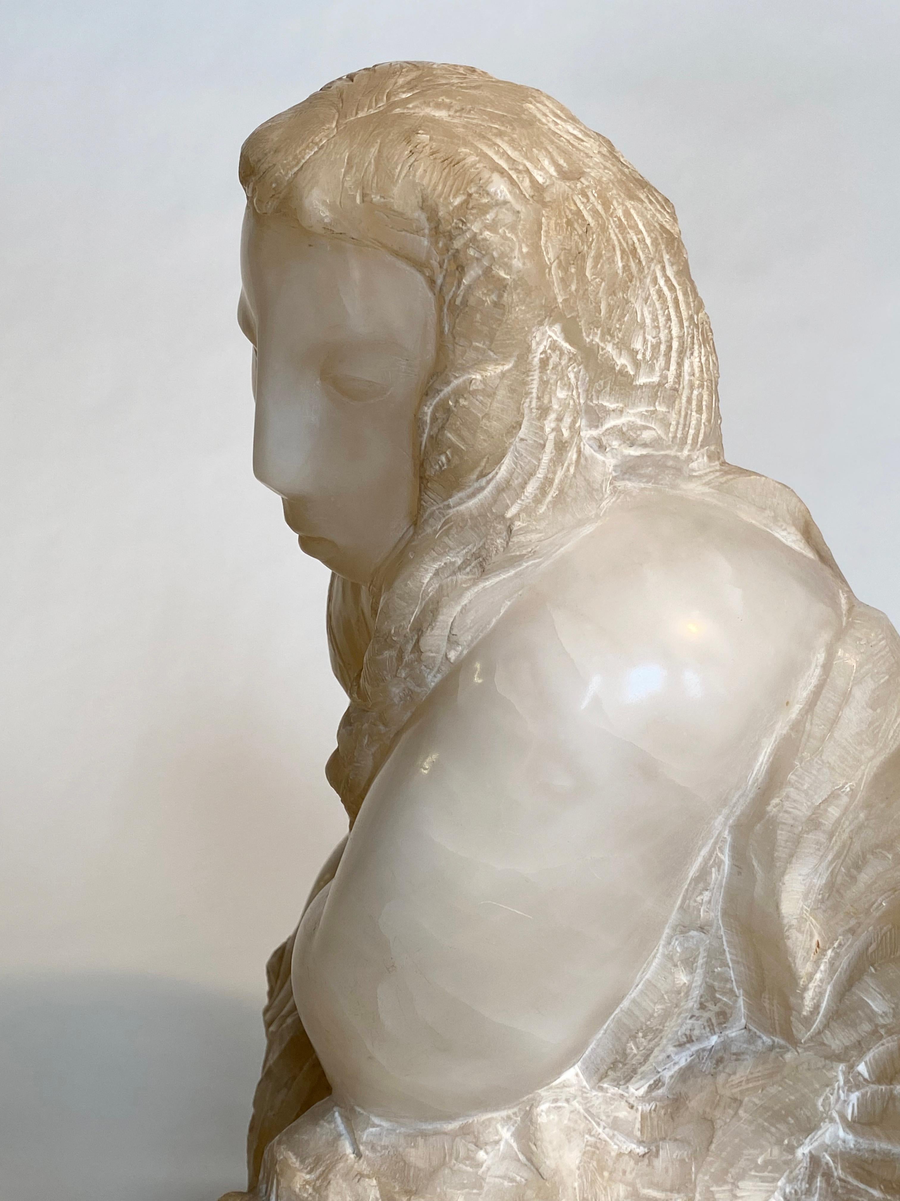 This romantic and lovely Alabaster marble is classic Jose De Creeft who was a world recognized stone sculptor carver.  He has a remarkable career and story.  And this work is what he is best known to do.  Female form that has face and form emerging