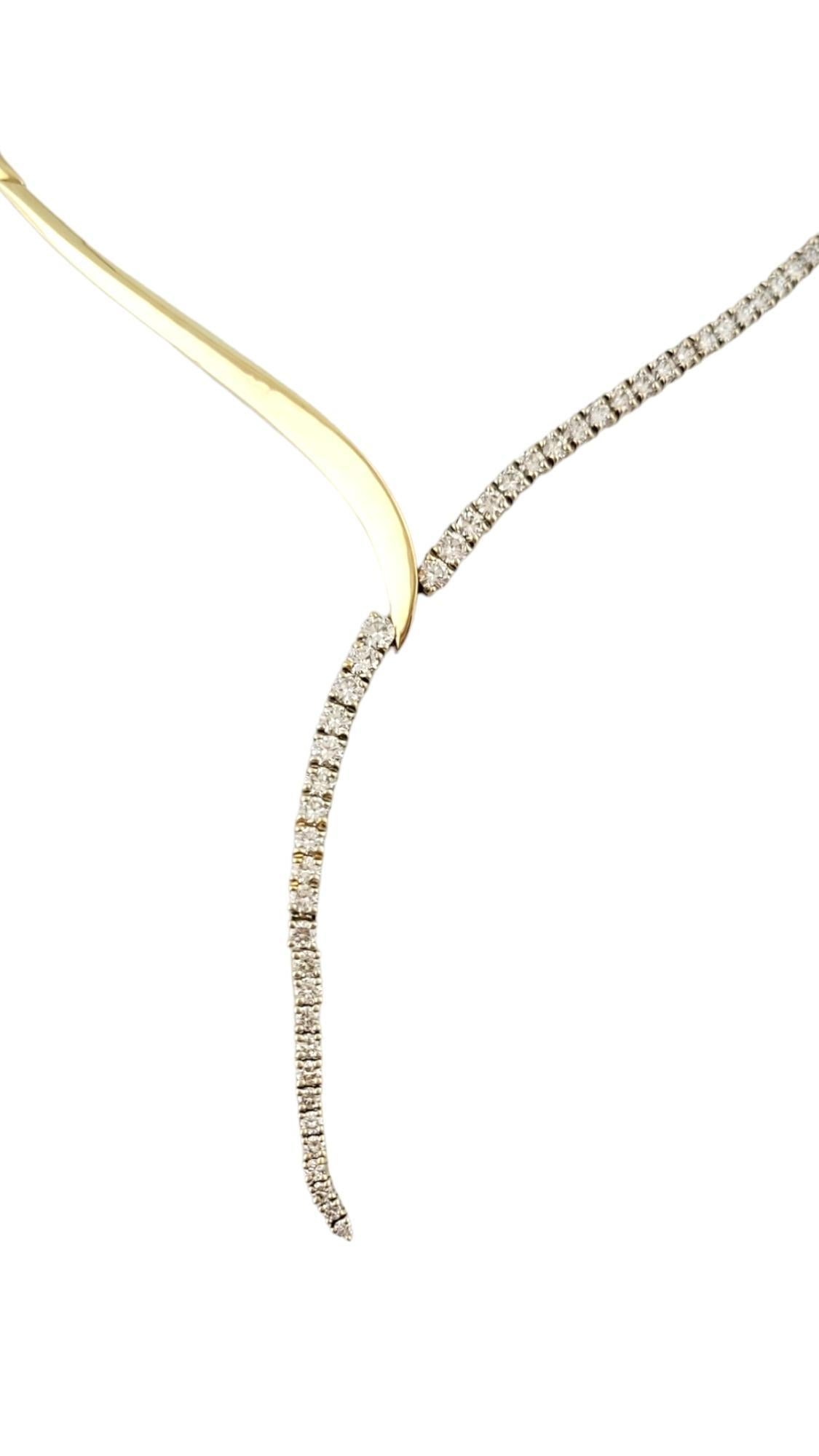 This spectacular drop necklace features 44 round brilliant cut diamonds set in beautifully detailed 14K yellow gold.

Approximate total diamond weight: 1.25 ct.

Diamond color:  G

Diamond clarity:  VS1

Size:  16 inches  (drop: 3 inches)

Weight: 