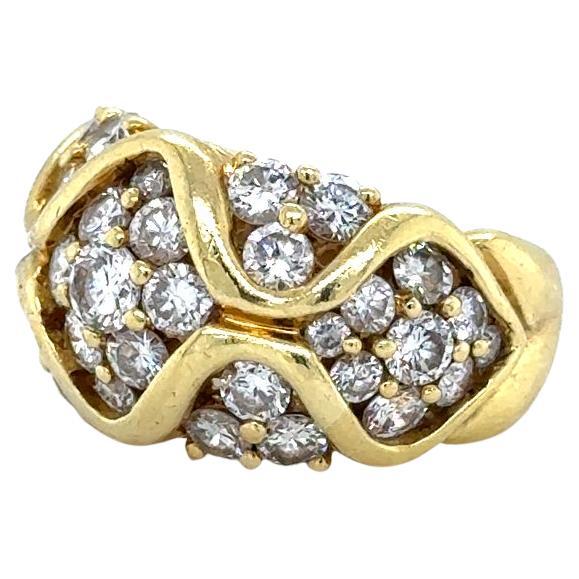 Beautiful show stopping ring by famed designer Jose Hess. The ring, crafted in 18k yellow gold highlights graduated sized earth mined natural diamonds throughout. The ring features a unique design as the gold almost weaves through the diamonds