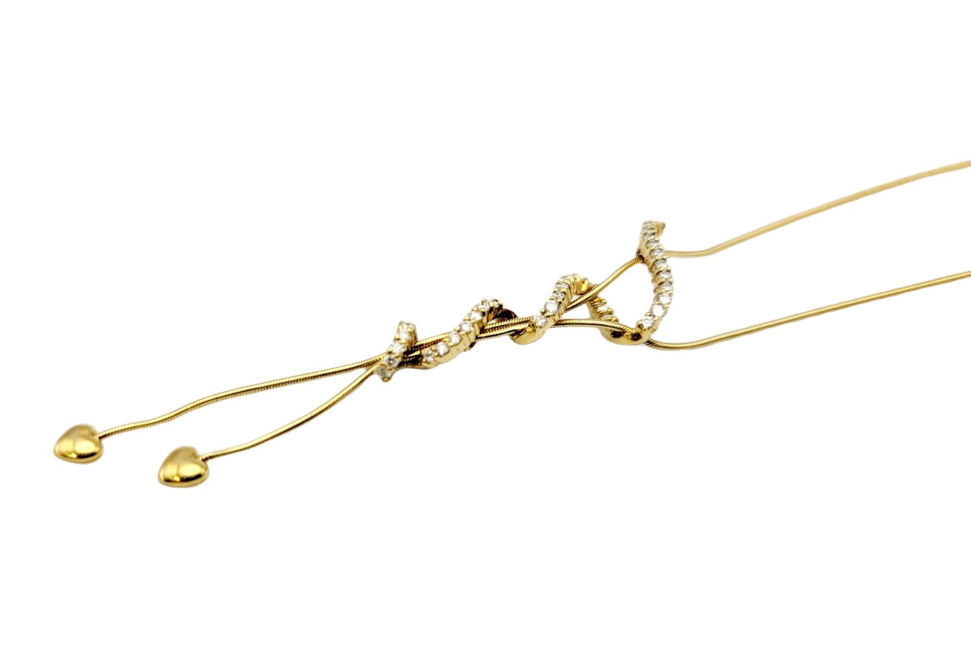 Contemporary Jose Hess 18 Karat Yellow Gold Drop Necklace with Hearts and Diamond Squiggle For Sale