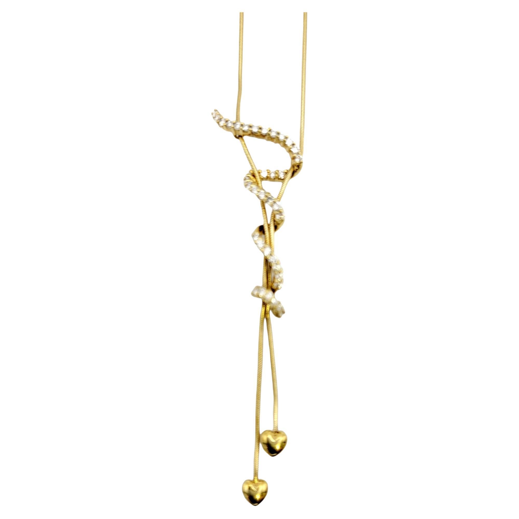 Jose Hess 18 Karat Yellow Gold Drop Necklace with Hearts and Diamond Squiggle For Sale