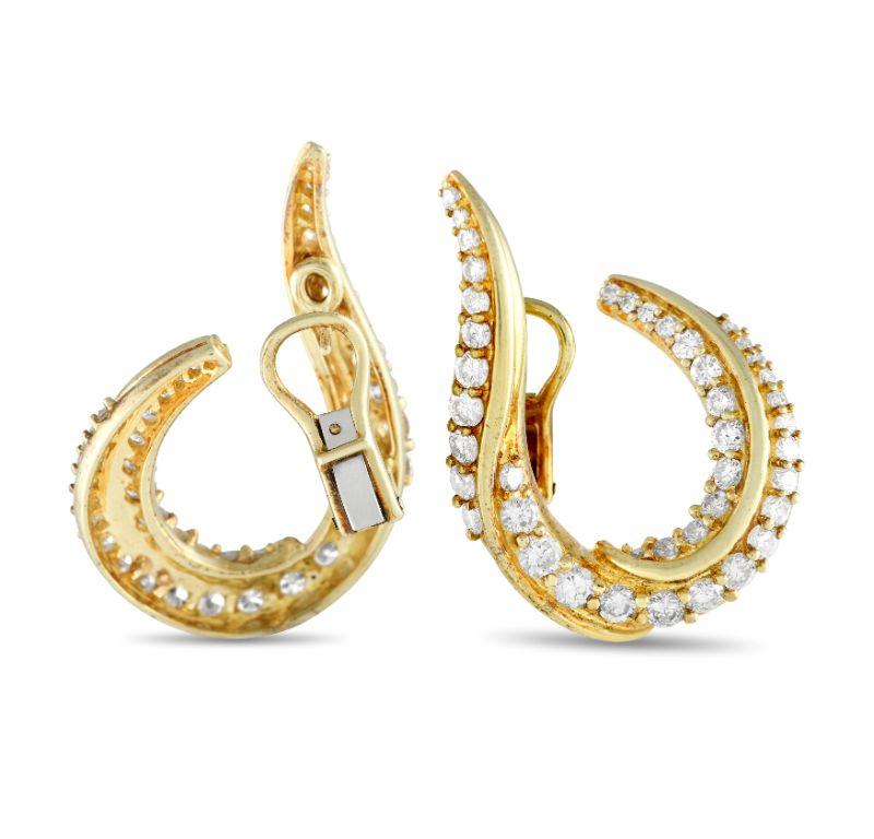 These Jose Hess earrings are bold, eye-catching, and unlike anything you have seen before. The curved 18K Yellow Gold setting provides these earrings with an organic elegance, while diamonds totaling 3.50 carats further elevate their unique design.