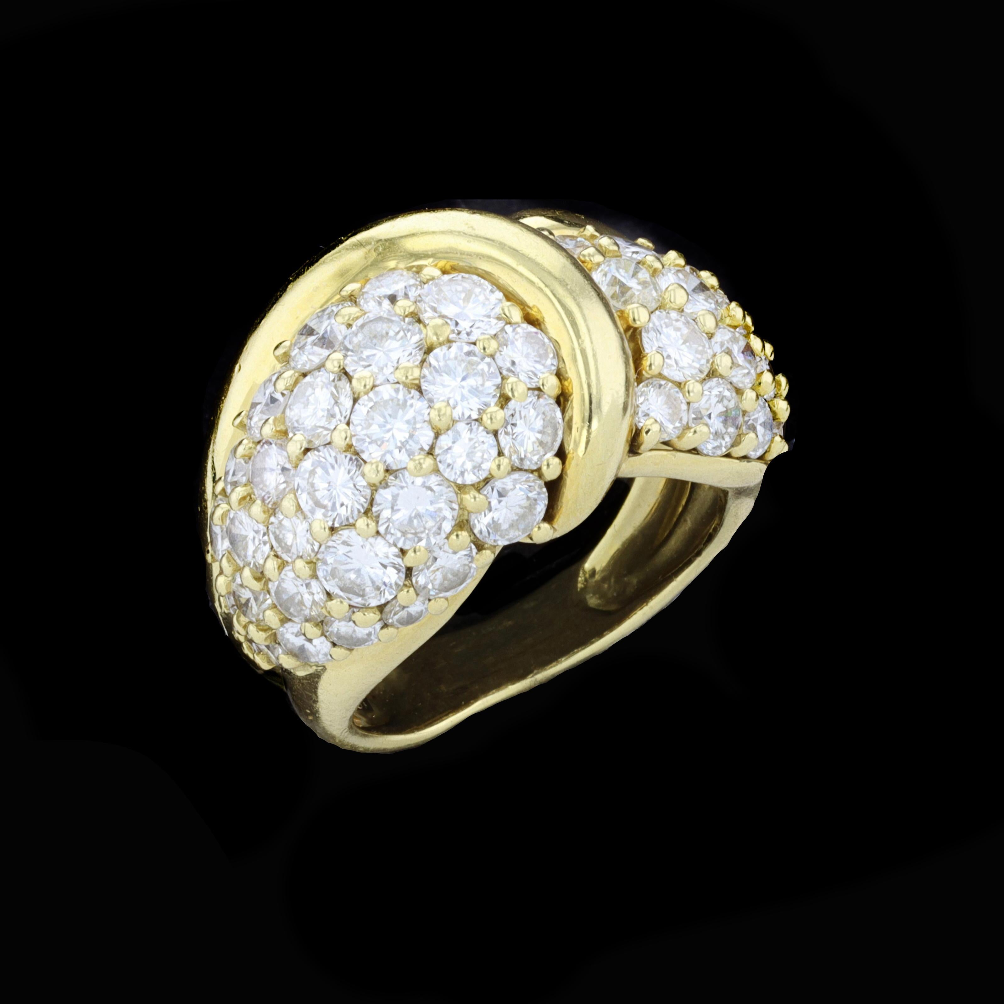 Glamour, glitter, and superb sparkle reign supreme in this gloriously gorgeous statement ring by designer Jose Hess. The 18K yellow gold ring is set with sparkling round cut diamonds that weigh approximately 5.50ct. The color of these diamonds is F