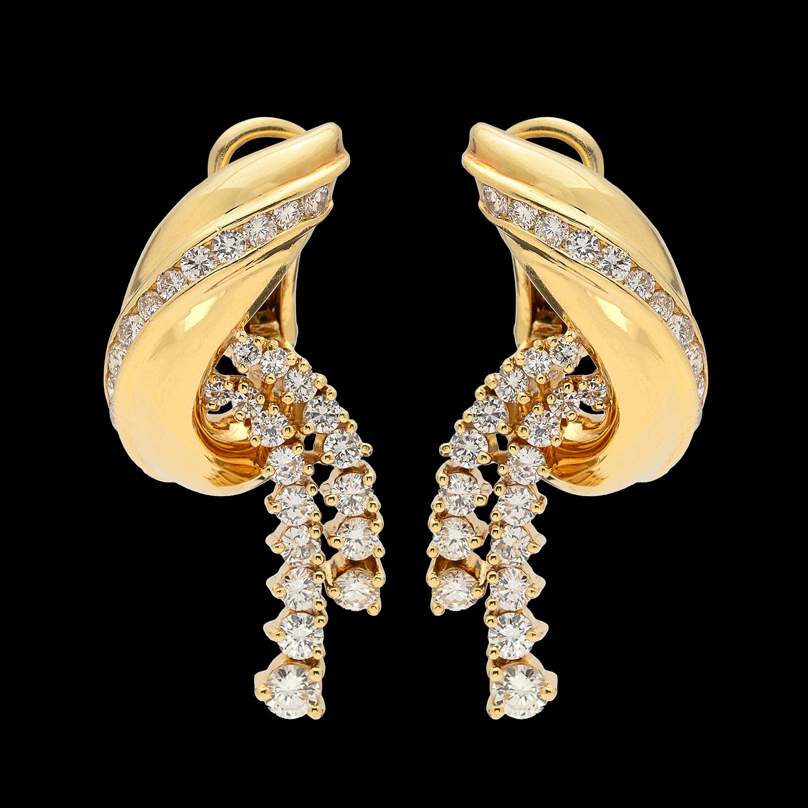 Beautifully made, these 18k gold earrings are articulated to move with you. Set with 56 cascading round brilliant-cut diamonds, of high G-H/VS quality, the gem weight totals approximately 3.20 carats. They weigh 19.6 grams and measure 1 1/2