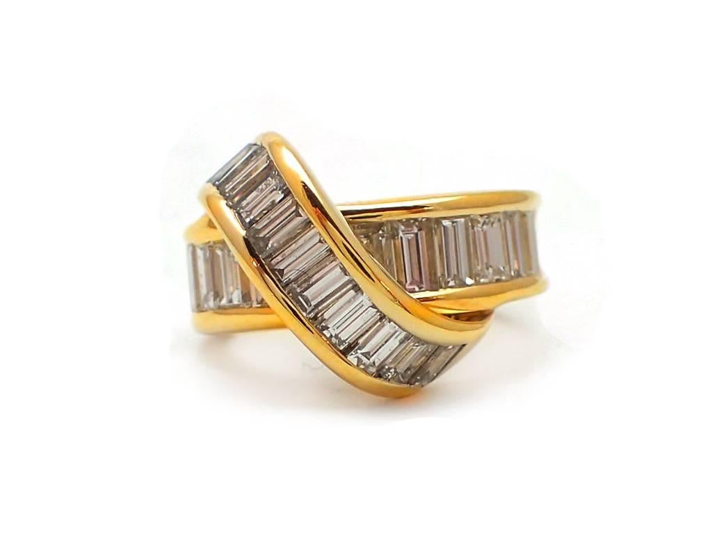 Make this special Jose Hess designer ring your very own! Its one-of-a-kind shape will make this 18kt yellow gold ring the perfect statement piece. It features 23 baguette diamonds totaling 2.65ct. This piece is signed and numbered.

Finger size 5.75