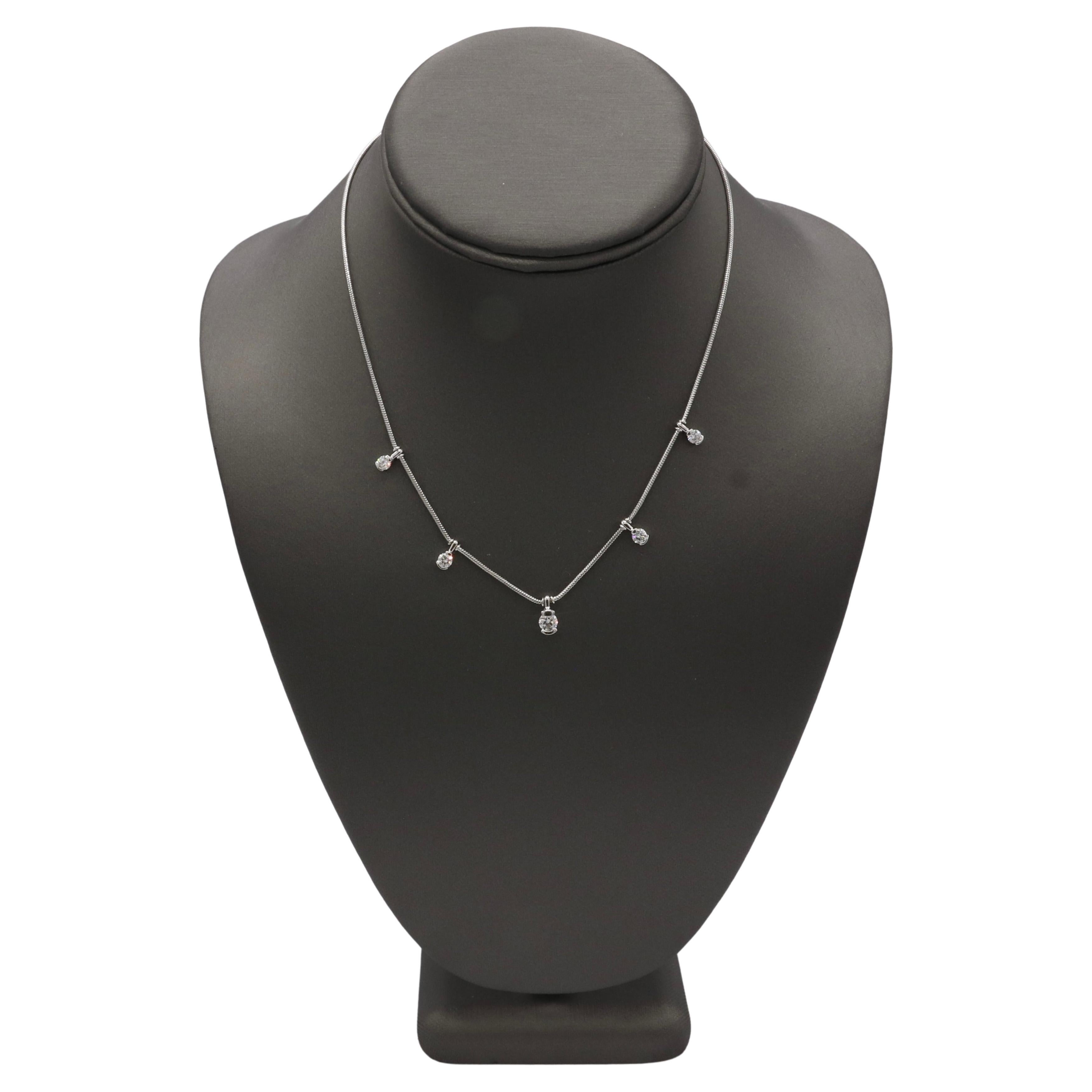 Jose Hess 'Garden Lights' Natural Diamond Station Necklace 18K White Gold 
Metal: 18k white gold
Weight: 6.68 grams
Diamonds: 1.09 CTW natural round diamonds G VS. Center Diamond is approx. .38 carat
Length: 16 inche snake chain
Signed: ©Jose Hess