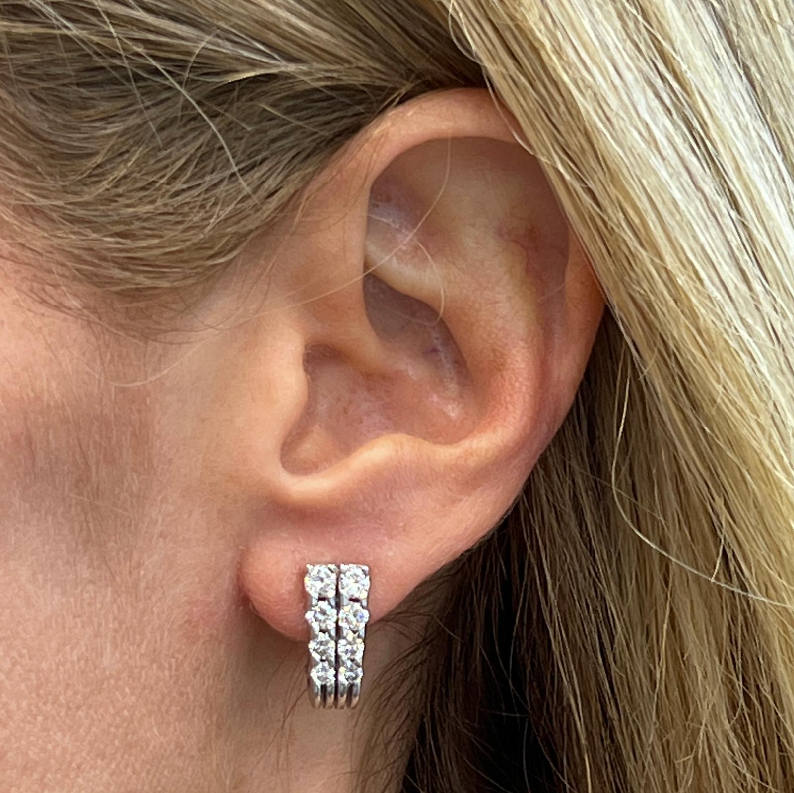 Beautiful two row diamond earrings by designer Jose Hess fashioned in 14 karat white gold. The earrings feature 16 round brilliant cut diamonds weighing 2.00 carat total weight and graded H-I color and VS2-SI1 clarity. The earrings are lightweight,