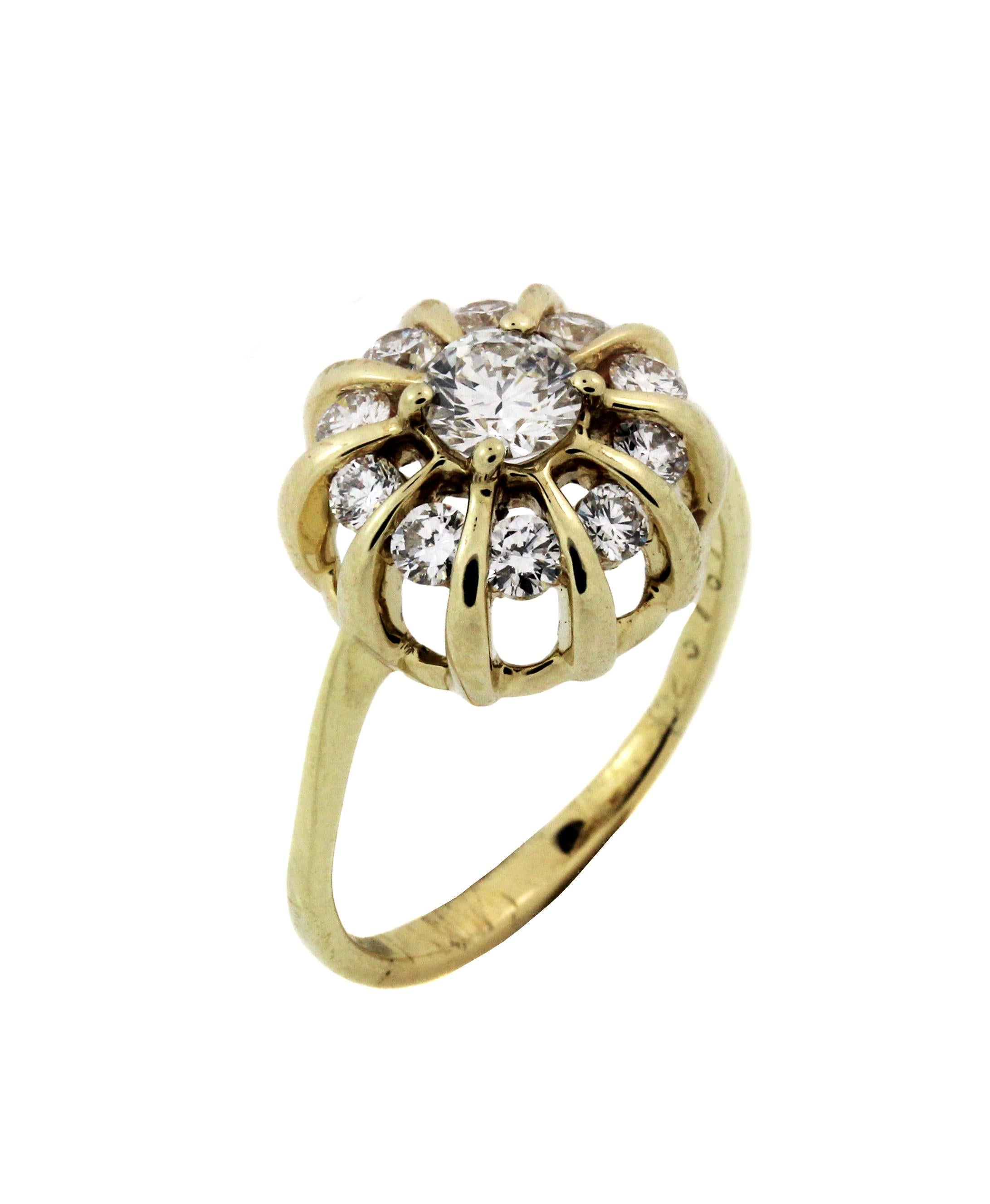 18K Yellow Gold and Diamond Ring by Jose Hess

Center has 0.35 carat G Color, VS2 clarity diamond
Center has another 0.50 carat G color VS clarity diamonds surrounding.

Face is 12mm (0.47 inch) in width

Band is 1.5 mm thick.

Signed Jose Hess.