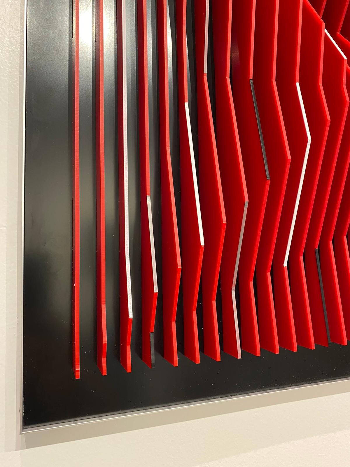 This unique piece by Margulis is from his latest body of works. After assembling the Plexiglas sheets onto the aluminium core, he uses acrylic paints to cover some the front of the sheets. 
Margulis’ utmost concern is the creation of geometric