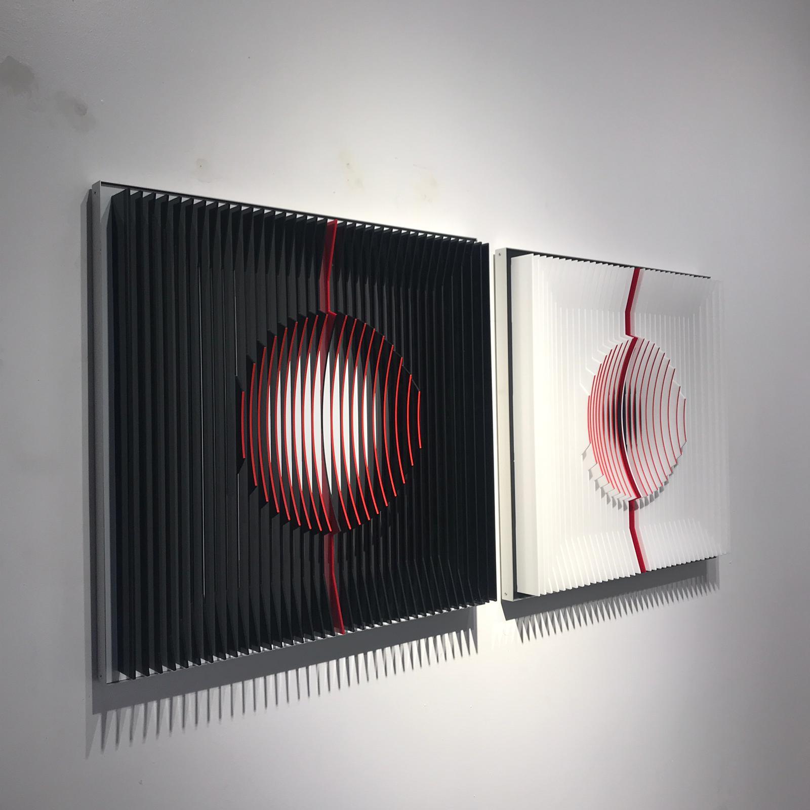 Red filled Moons - kinetic wall sculpture by J. Margulis