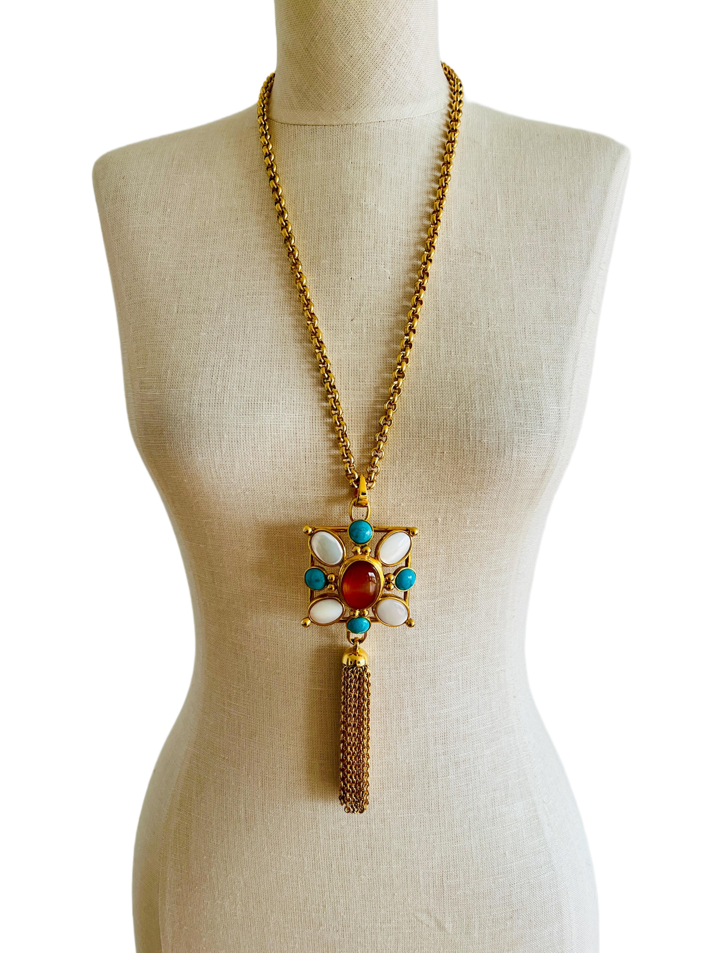 Elevate your haute couture, runway, and statement look with this fabulous square pendant tassel necklace that features natural carnelian, turquoise and mother-of-pearl by designer Jose & Maria Barrera.  

Designer: Jose & Maria Barrera.
Size: The