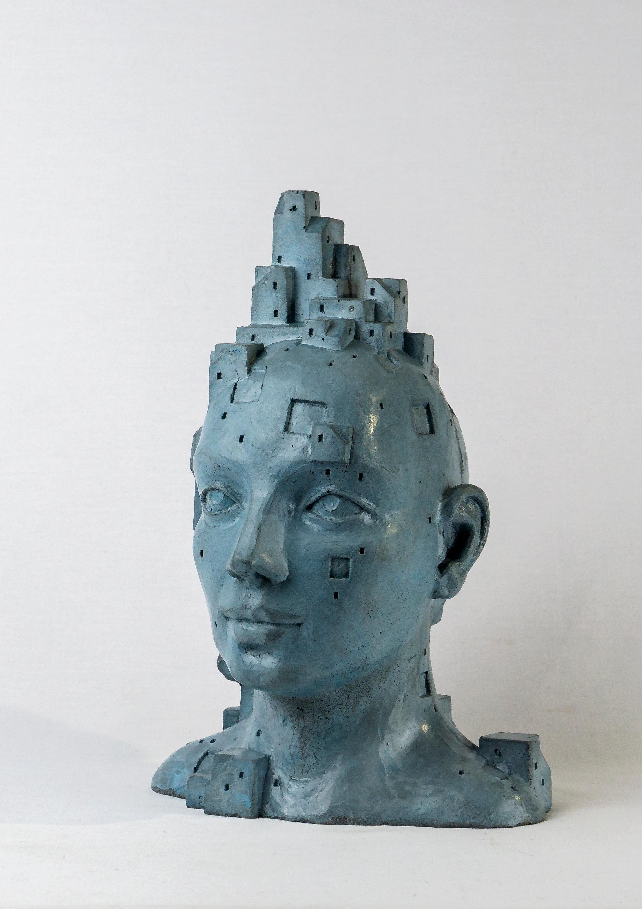 Escultura retrato de cemento azul-gris. 