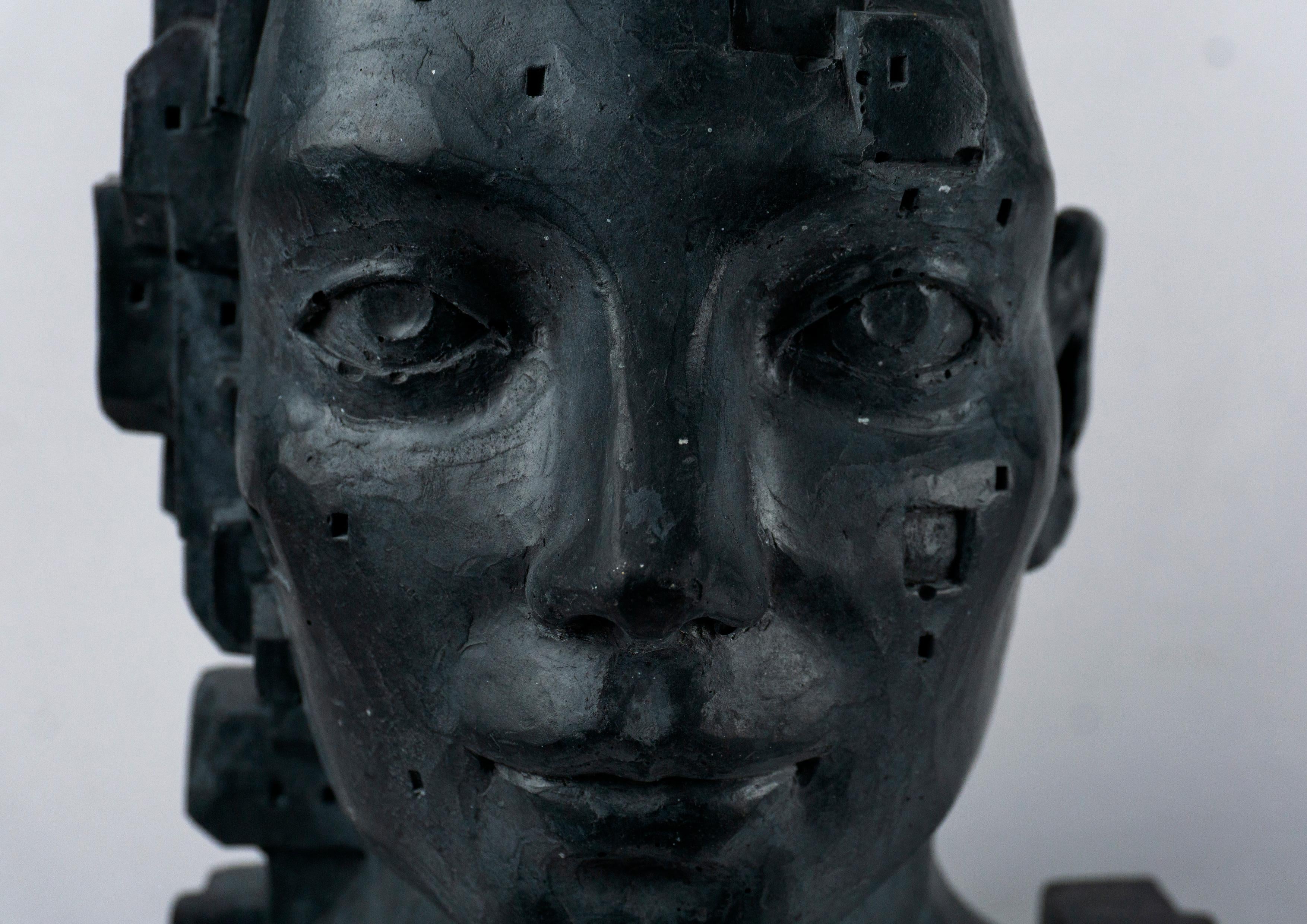 Busto figurativo architettonico ibrido in cemento nero. Antropotecnica 