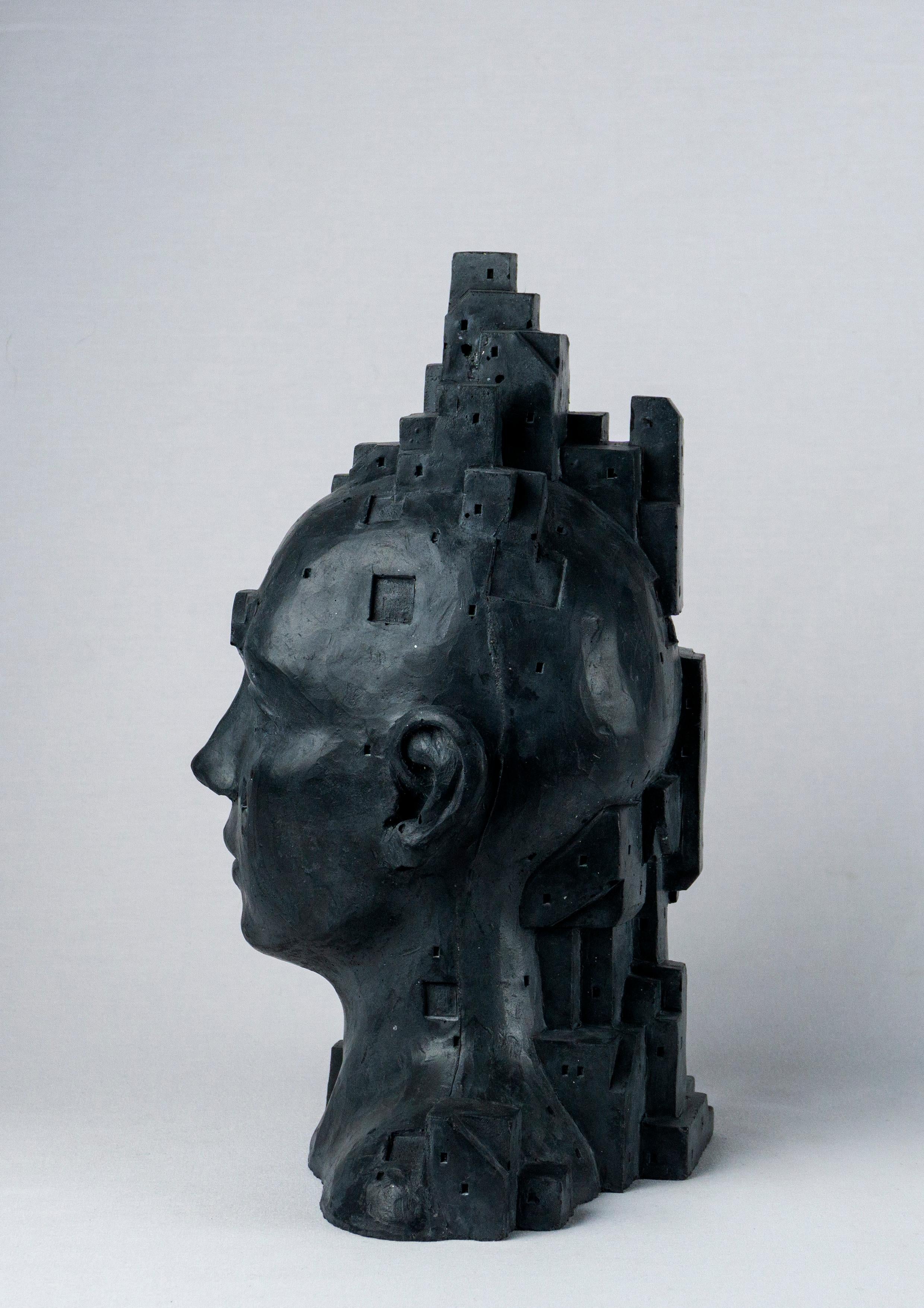 Busto figurativo architettonico ibrido in cemento nero. Antropotecnica 