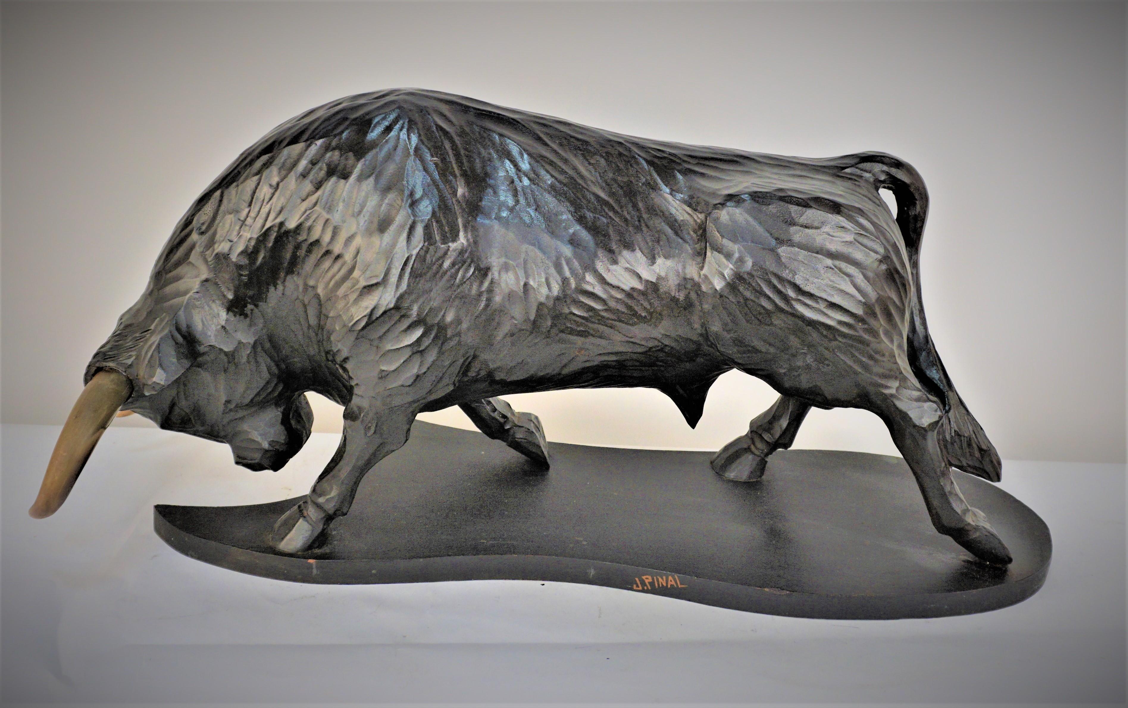 Beautiful Mexican carved wood of a bull with real horn by Jose Pinal