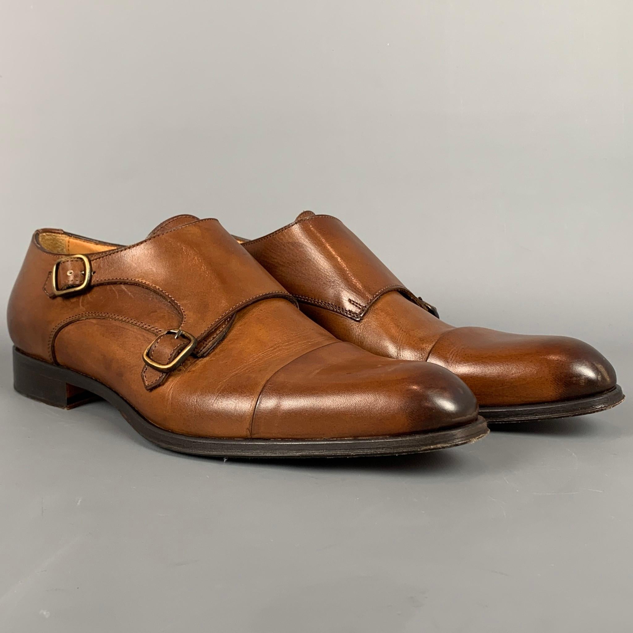 JOSE REAL loafers comes in a cognac antique leather featuring a double monk strap, cap toe, and and wooden sole. Includes box. Made in Italy.

Very Good Pre-Owned Condition.
Marked: T 617 45
Original Retail Price: $495.00

Outsole: 12.5 in. x 4 in.