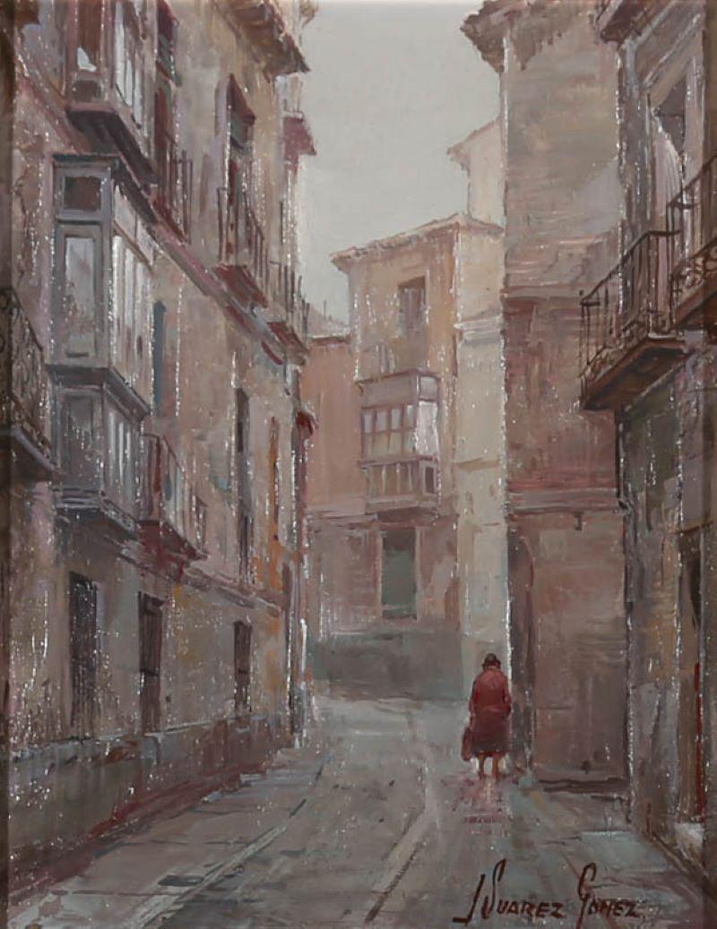 A fine architectural scene by Spanish artist Jose Suarez Gomez, depicting a residential side street in the ancient city of Toledo. Signed to the lower right corner. Beautifully presented in a white painted slip and ornate gilt-effect frame. On