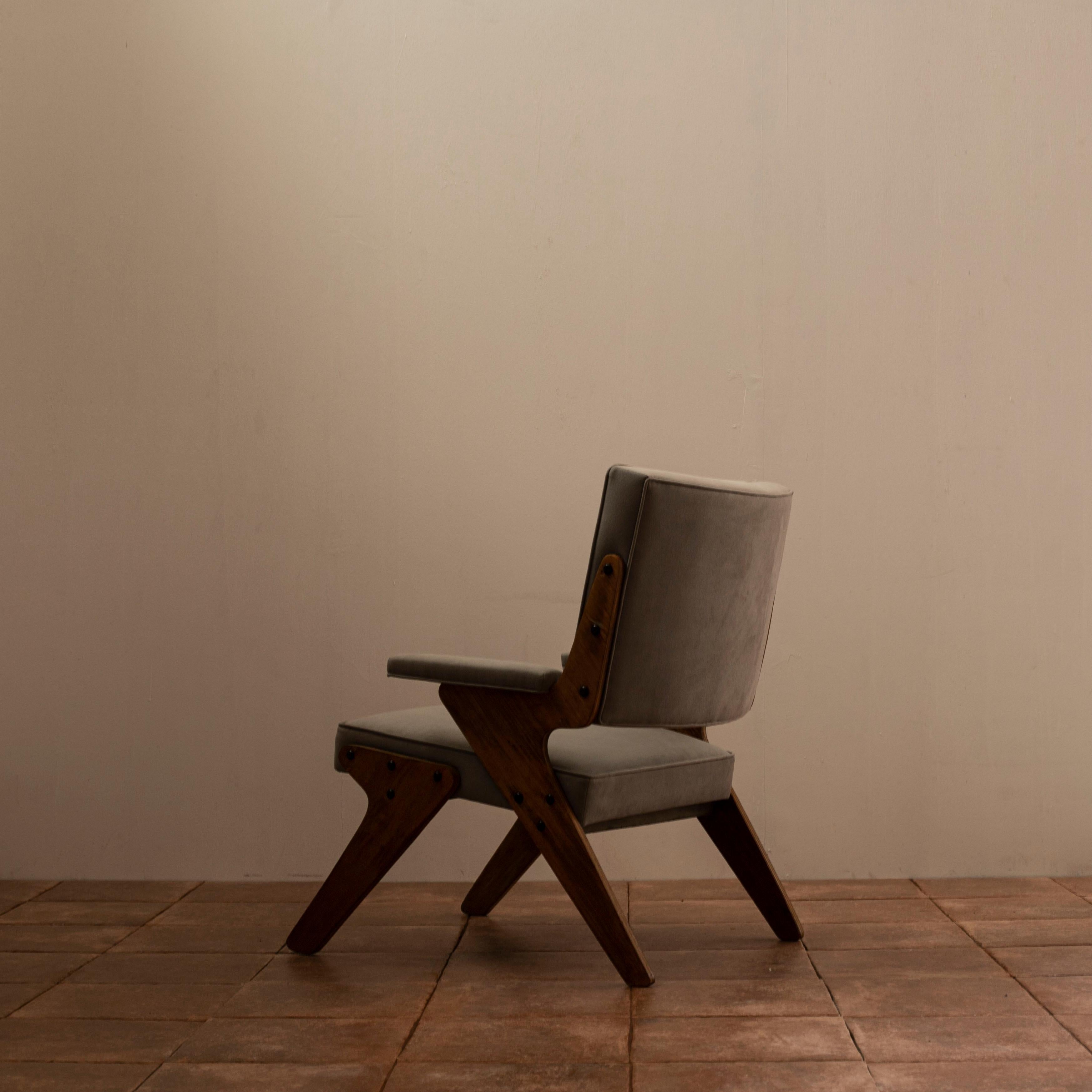 Armchair designed by José Zanine Caldas in 1950s.
Plywood frames.
Recently reupholstered.
  