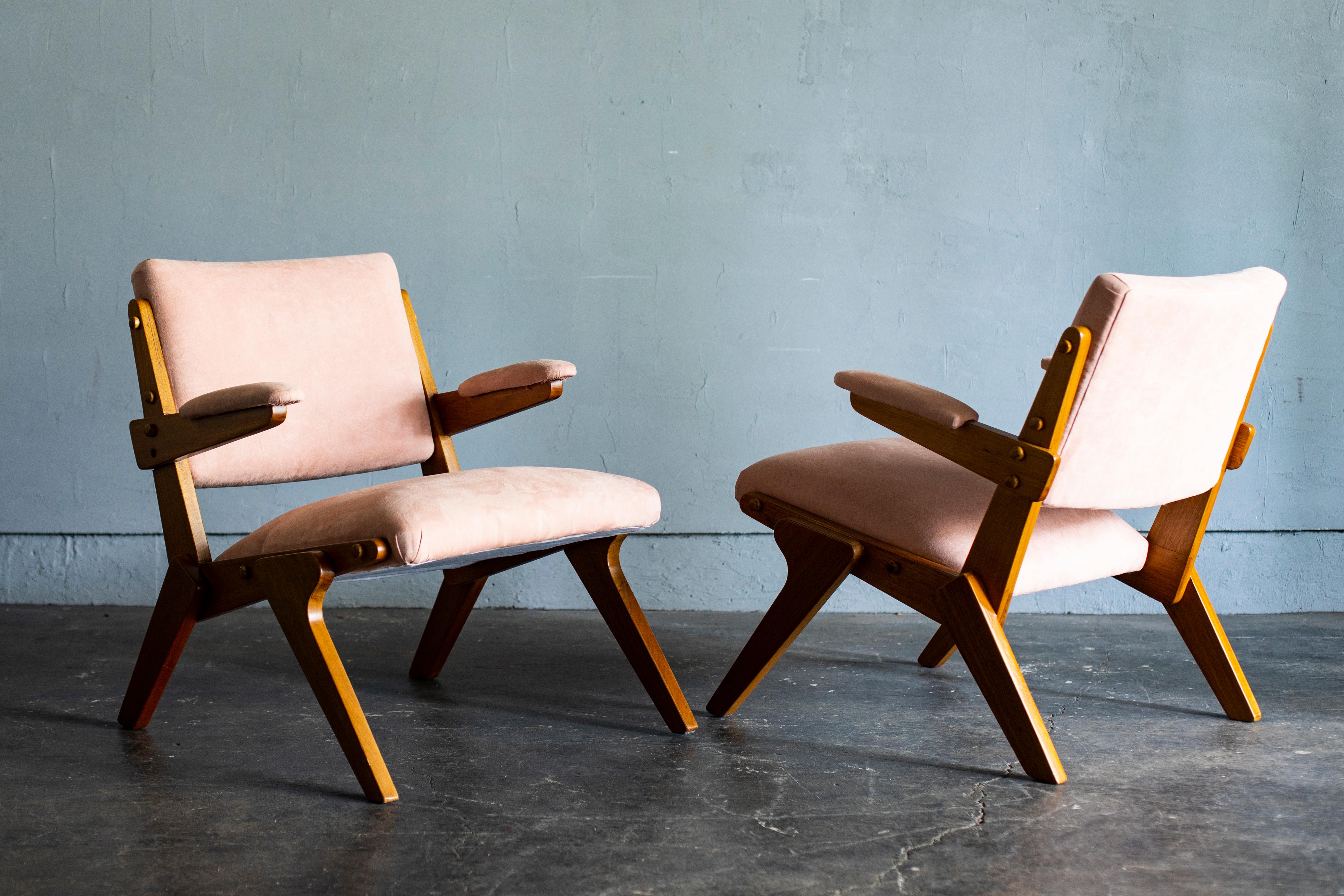 A pair of beautiful armchairs designed by José Zanine Caldas from Brazil.
Reupholstered with light pink colored fabric.
Very good vintage condition.