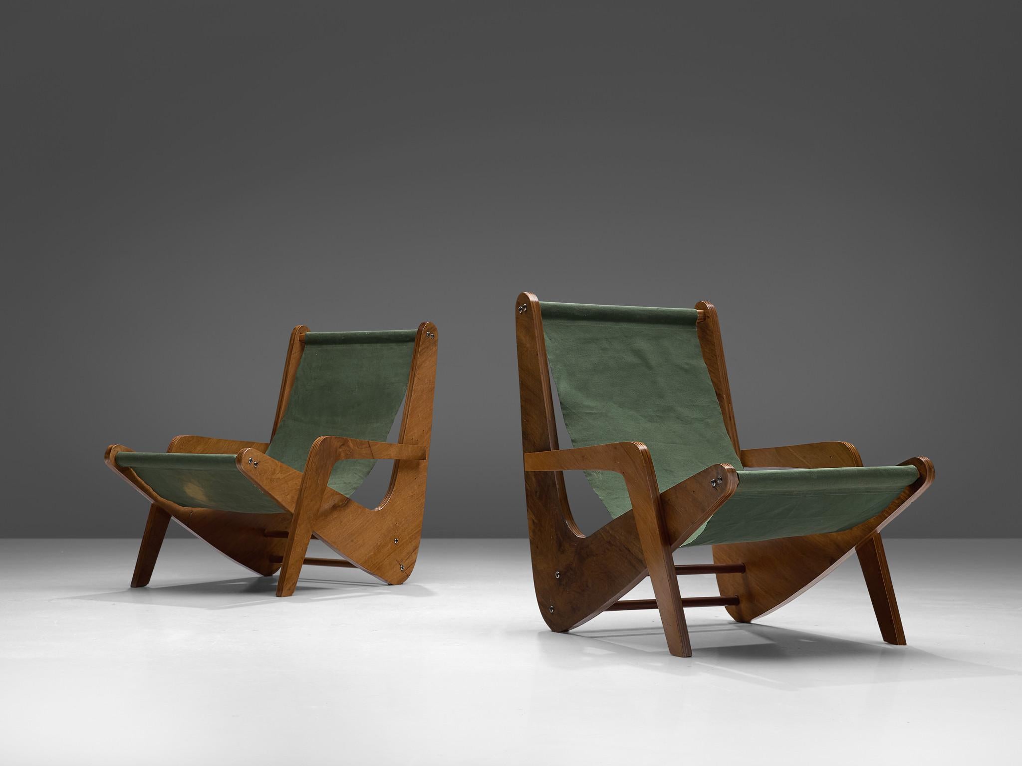 José Zanine Caldas for Móveis Artisticos Z, pair of 'Boomerang' chairs, plywood and fabric, Brazil, 1950s.

This Boomerang lounge chair by José Zanine Caldas emphasizes the innovative use of plywood the designer is known for in his earlier years.
