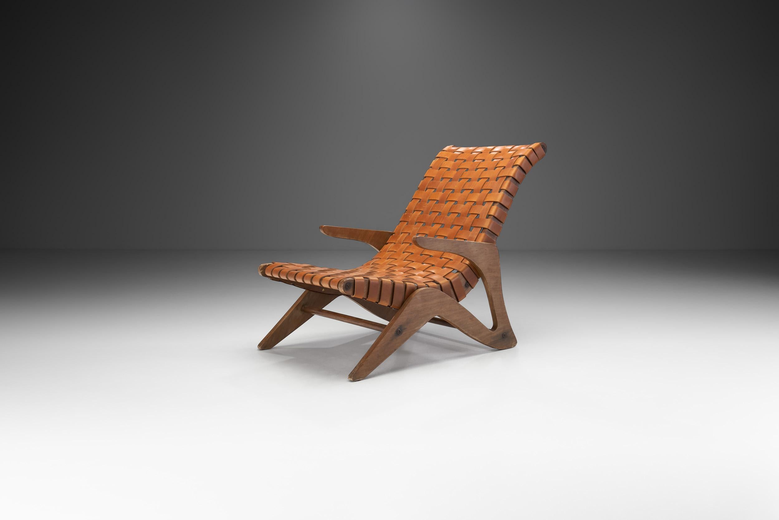 This beloved José Zanine Caldas lounge chair from the “Linha Z” or “Z Line” is an exceptional example of Brazilian design of the 1950s. The design dates to 1949, The woven leather straps and the organic shape is unmatched.

This chair model is made