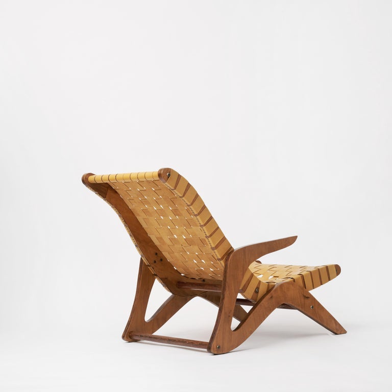 José Zanine Caldas 
Linea Z lounge chair - A pair is available
Manufactured by Movies Artisticos Z
Plywood, leather strap seating
Brazil, 1950s.