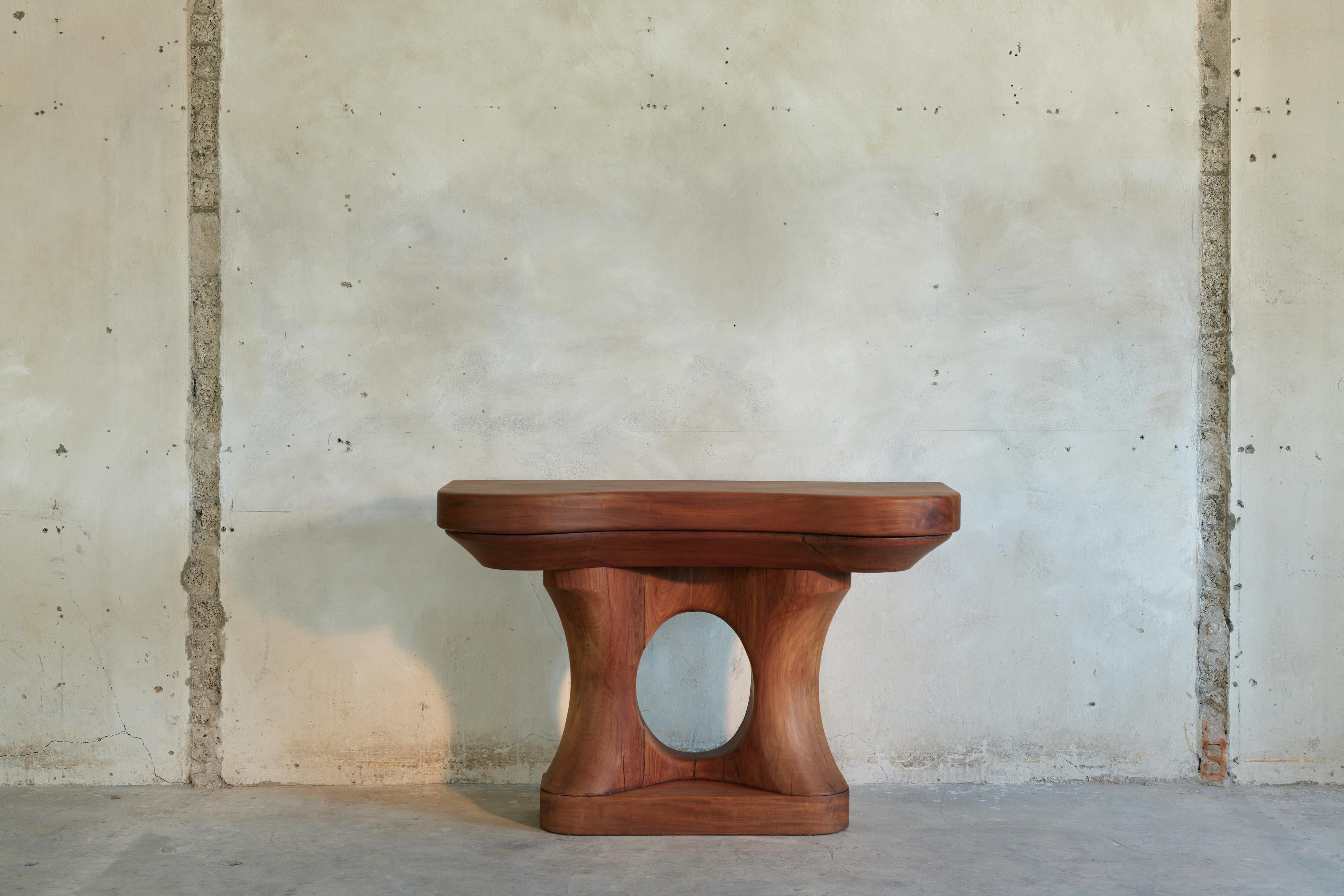 José Zanine Caldas, hand-carved console, Brazilian hardwood, Brazil, circa 1980

This beautifully sculpted console was made during a time in which Caldas abandoned the rigid design aesthetics of Modernism and solely worked with local materials.