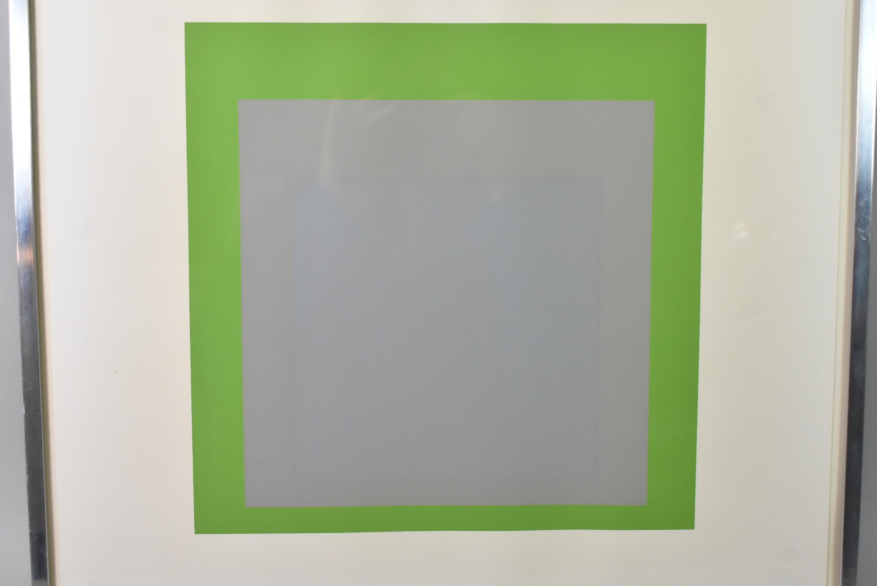Josef Albers 1965 print in green and grey from the Soft Edge Hard Edge Series, which is part of the broader Homage to the Square Series. Blind stamp in the lower right corner. Gallery tag on the reverse. Some paper waves. Overall 18