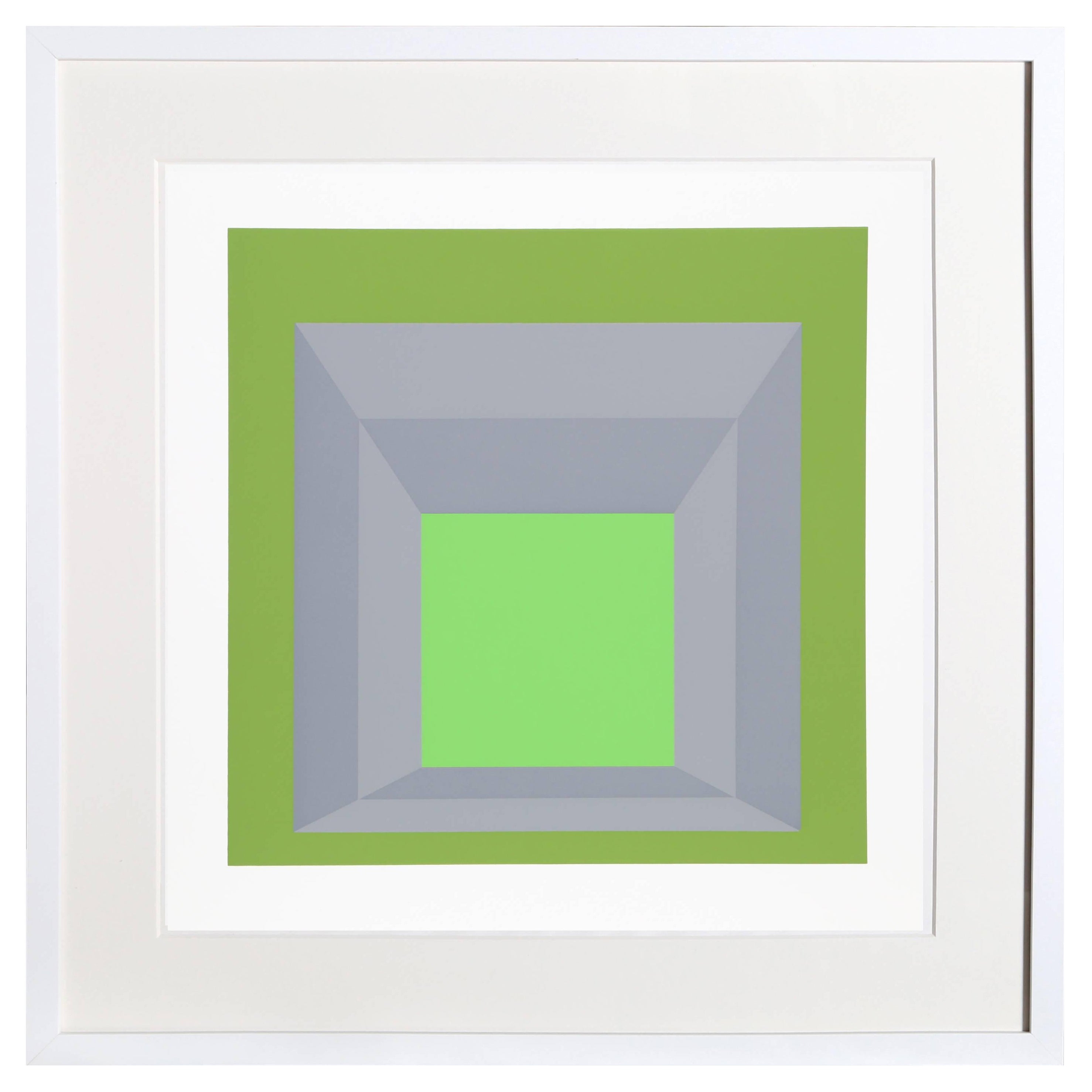 A green and gray composition that features a more dimensional rendition of Albers’ famous “Homage to the Square” series. The exterior ring of dark green flanks a window of gray before opening up to a brighter, more neon green at the center. From the