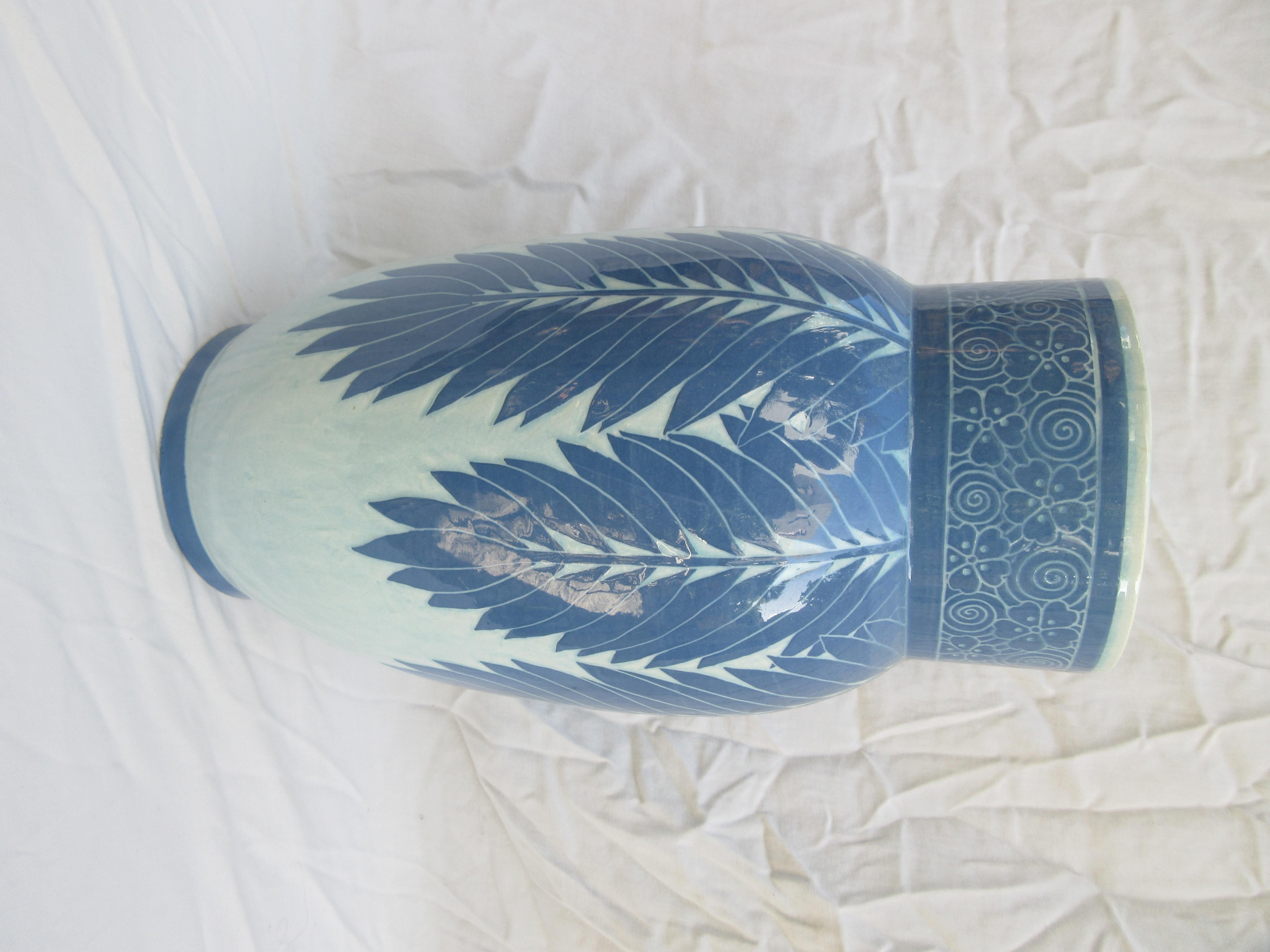 This is a handmade vase, and a very rare white and blue one. The only one of its kind. Signed and dated, J-Ekberg 1908. A Swedish artist that started working for the Gustavsberg ceramic foundry in Stockholm Sweden in 1898 and worked there till his