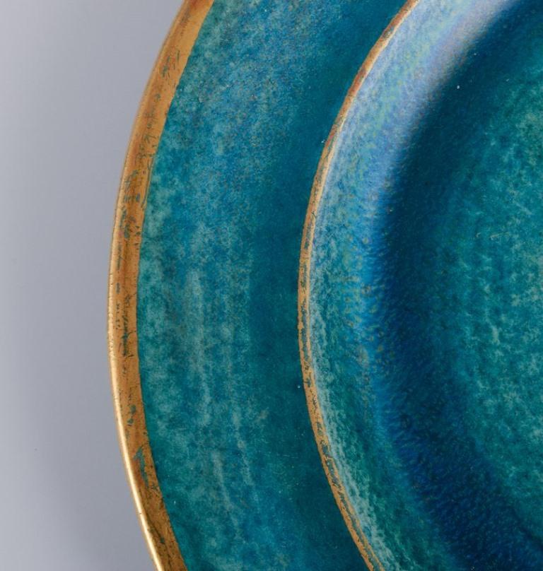 Glazed Josef Ekberg for Gustavsberg, Sweden. Set of ten ceramic plates. For Sale