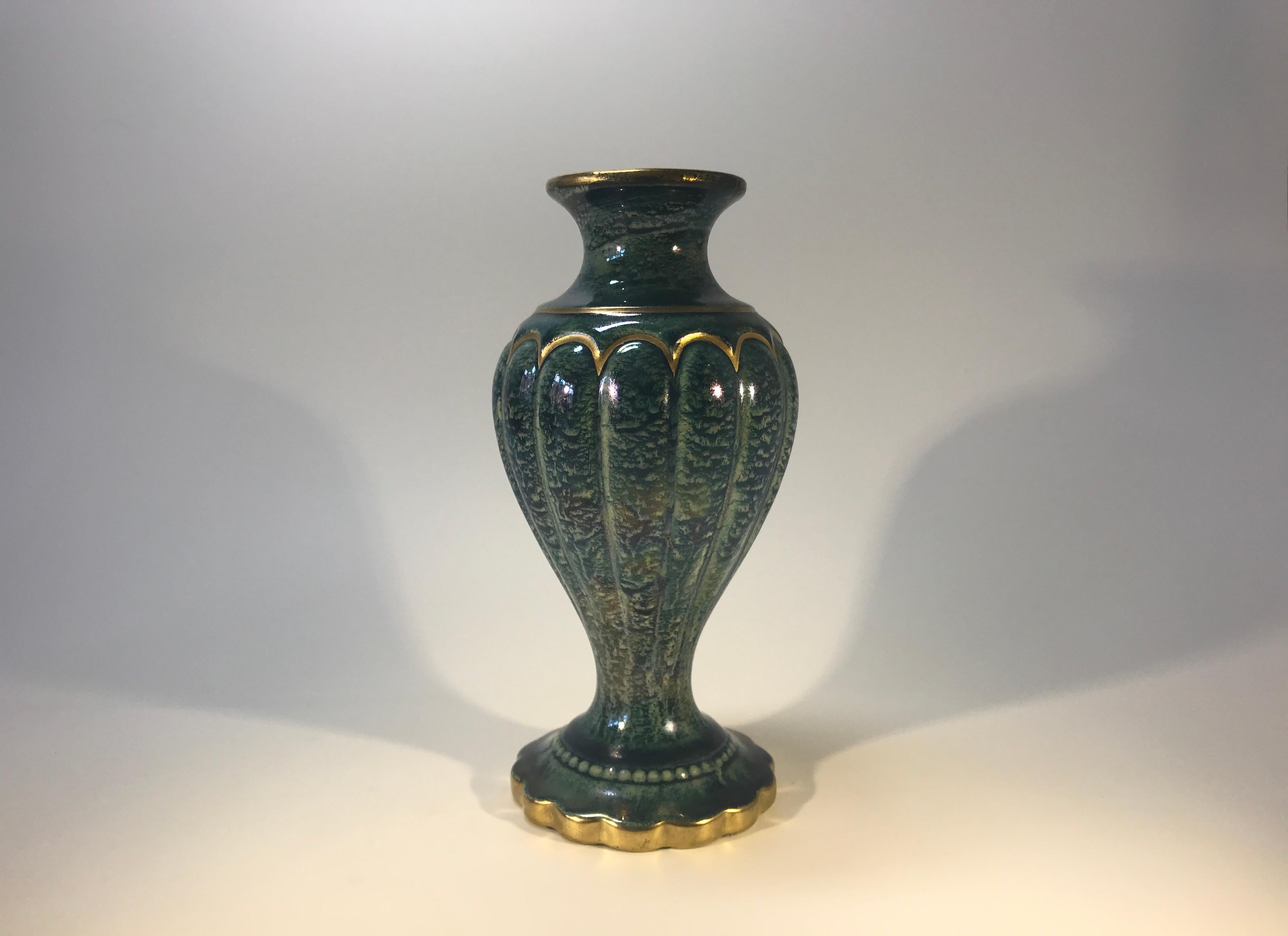Art Deco baluster vase by Josef Ekberg for Gustavsberg. Green-blue ethereal lustre glaze with hand decorated gilt decoration.
Signed and dated 1929 with Anchor mark
A beautiful example of Ekberg's craftsmanship
In very good condition with minor