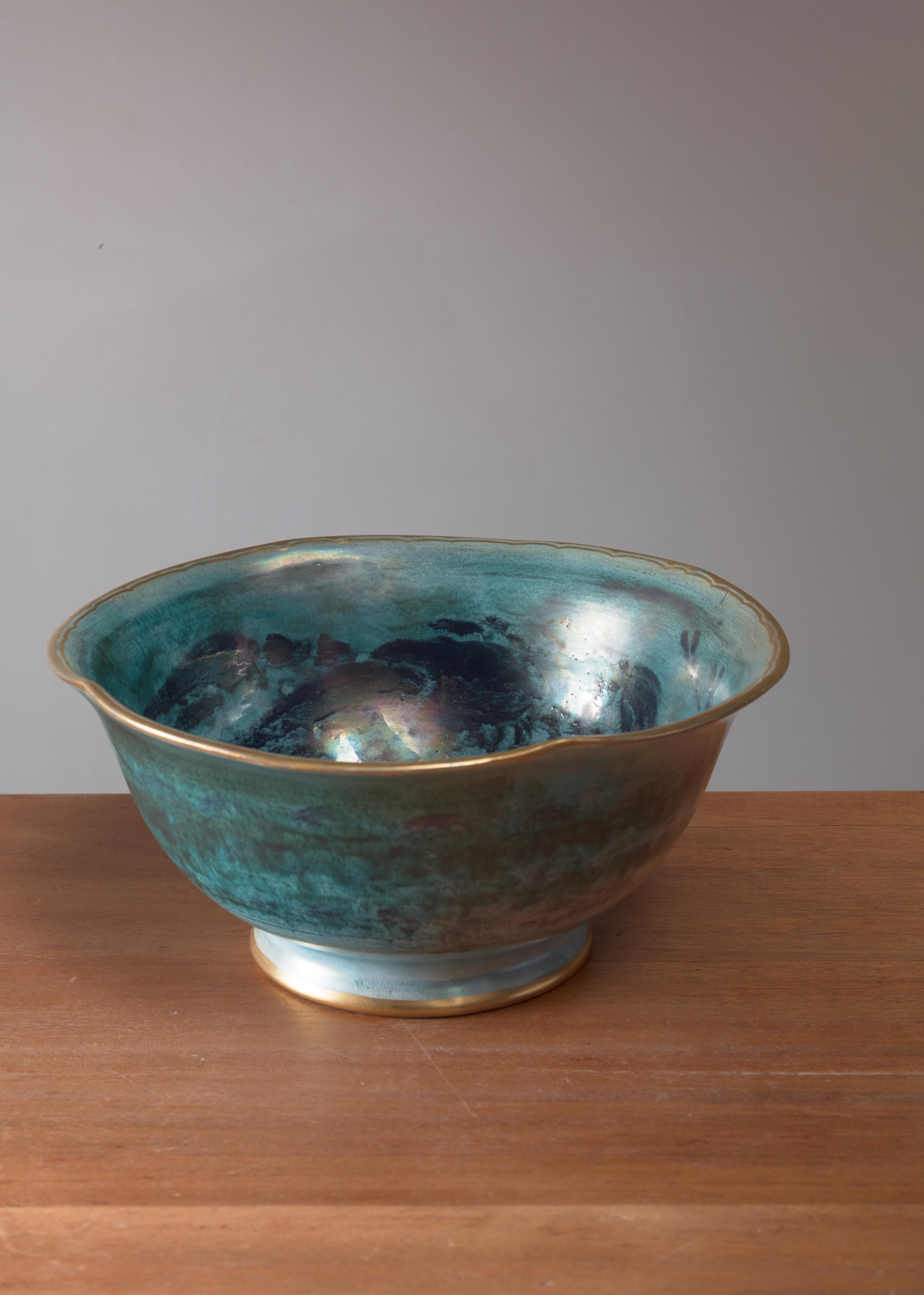 A large ceramic lustreware bowl by Josef Ekberg for Gustavsberg. The bowl has a gilt edge and is decorated with a seaweed and lobster motif.
Signed by Ekberg and Gustavsberg, with the year of production (1929).
 