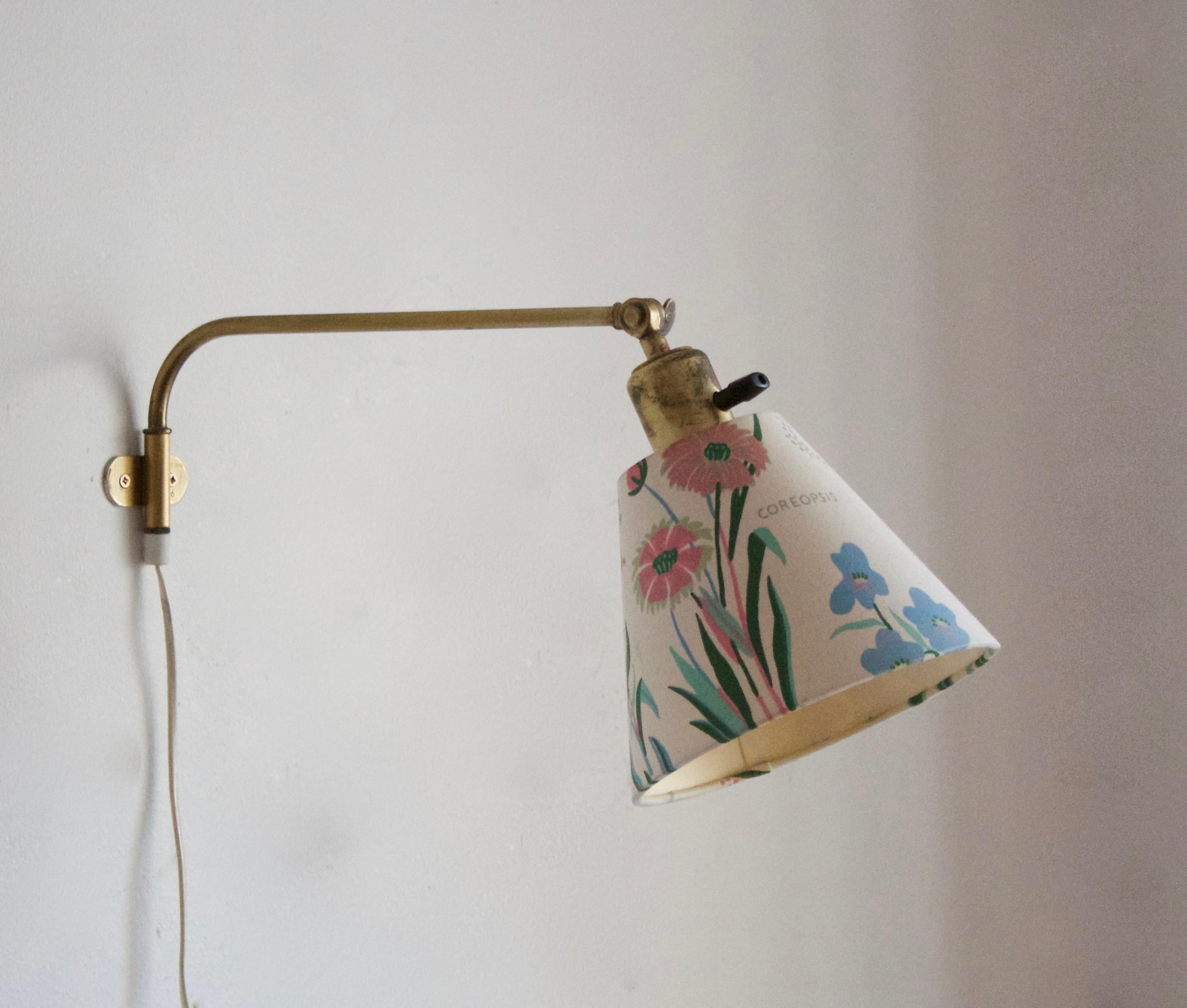 An adjustable wall light / sconce / task light. Designed by Josef Frank, produced by Svenskt Tenn, Stockholm, Sweden, c. 1950s. Original fabric lampshade. 

Please note that primary image duplicates one of the wall lights. Near identical pair in