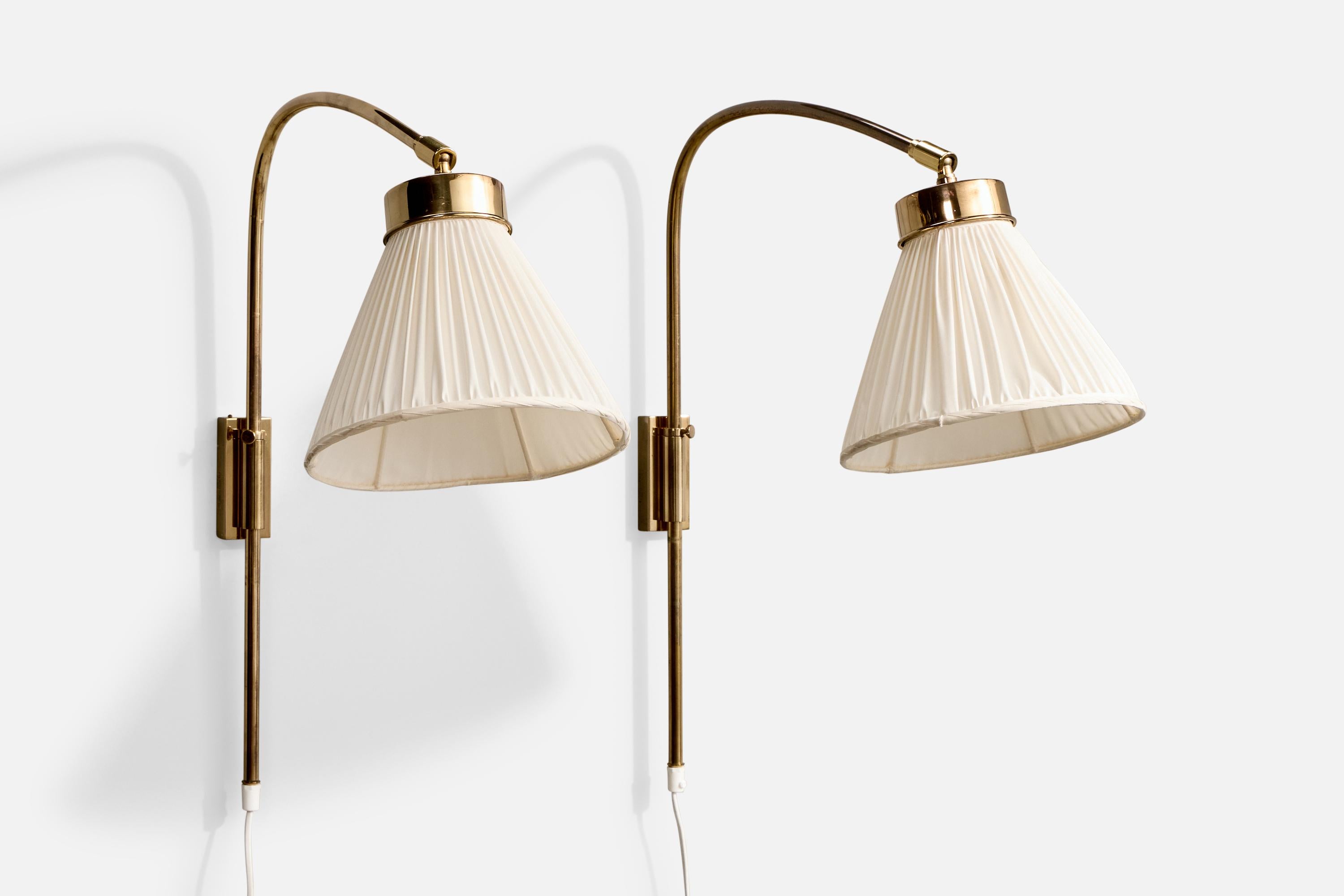 A pair of brass and white fabric wall lights designed by Josef Frank in the 1930s and produced by Svenskt Tenn, Sweden, c. 1990s.

Overall Dimensions (Inches): 23.5