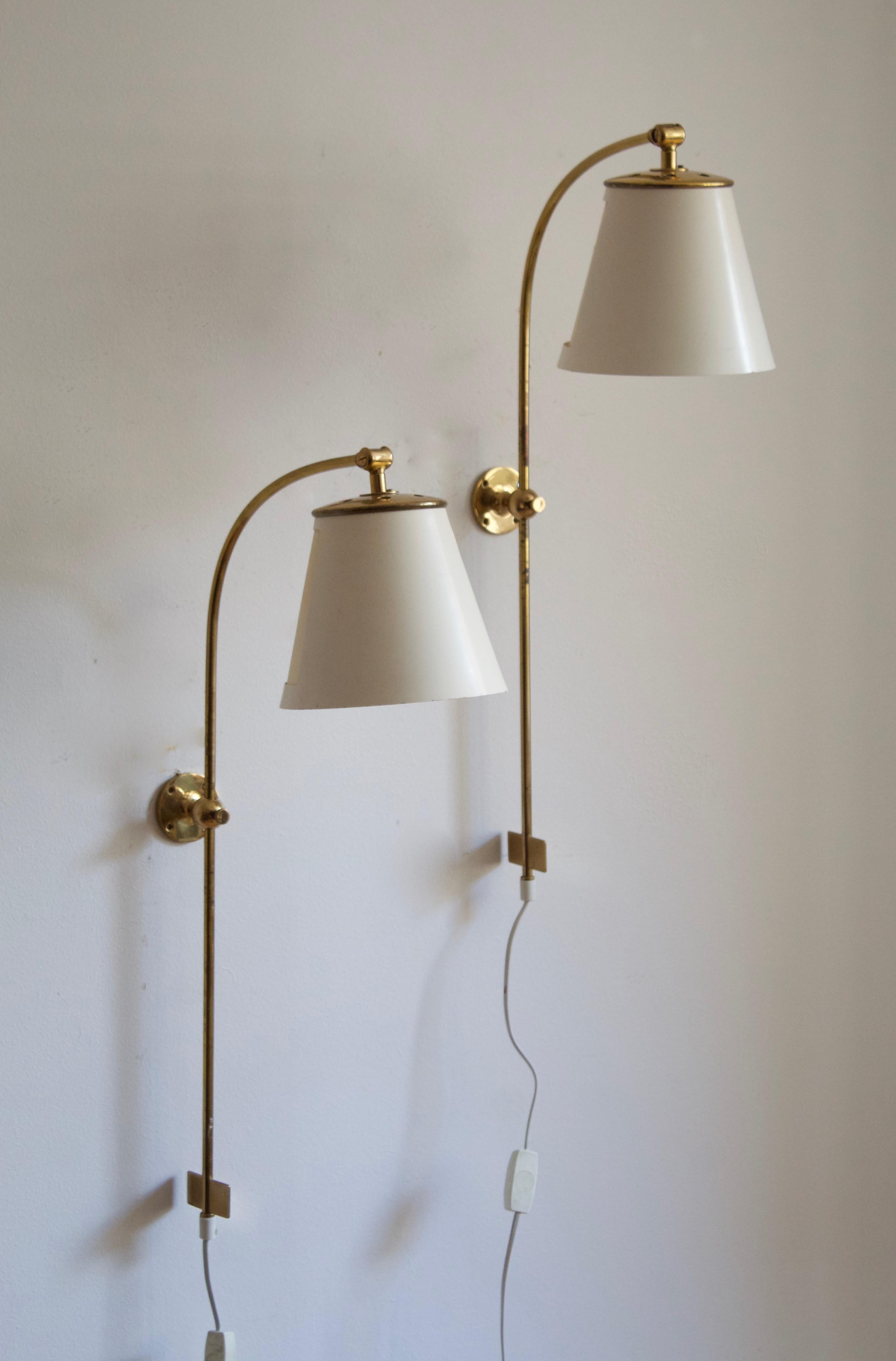 A pair of adjustable wall lights / sconces. Designed by Josef Frank, produced by Svenskt Tenn, Stockholm, Sweden, c. 1950s. Original lacquered metal / paper lampshades

Stated dimensions include lampshades as is illustrated.

Other designers of
