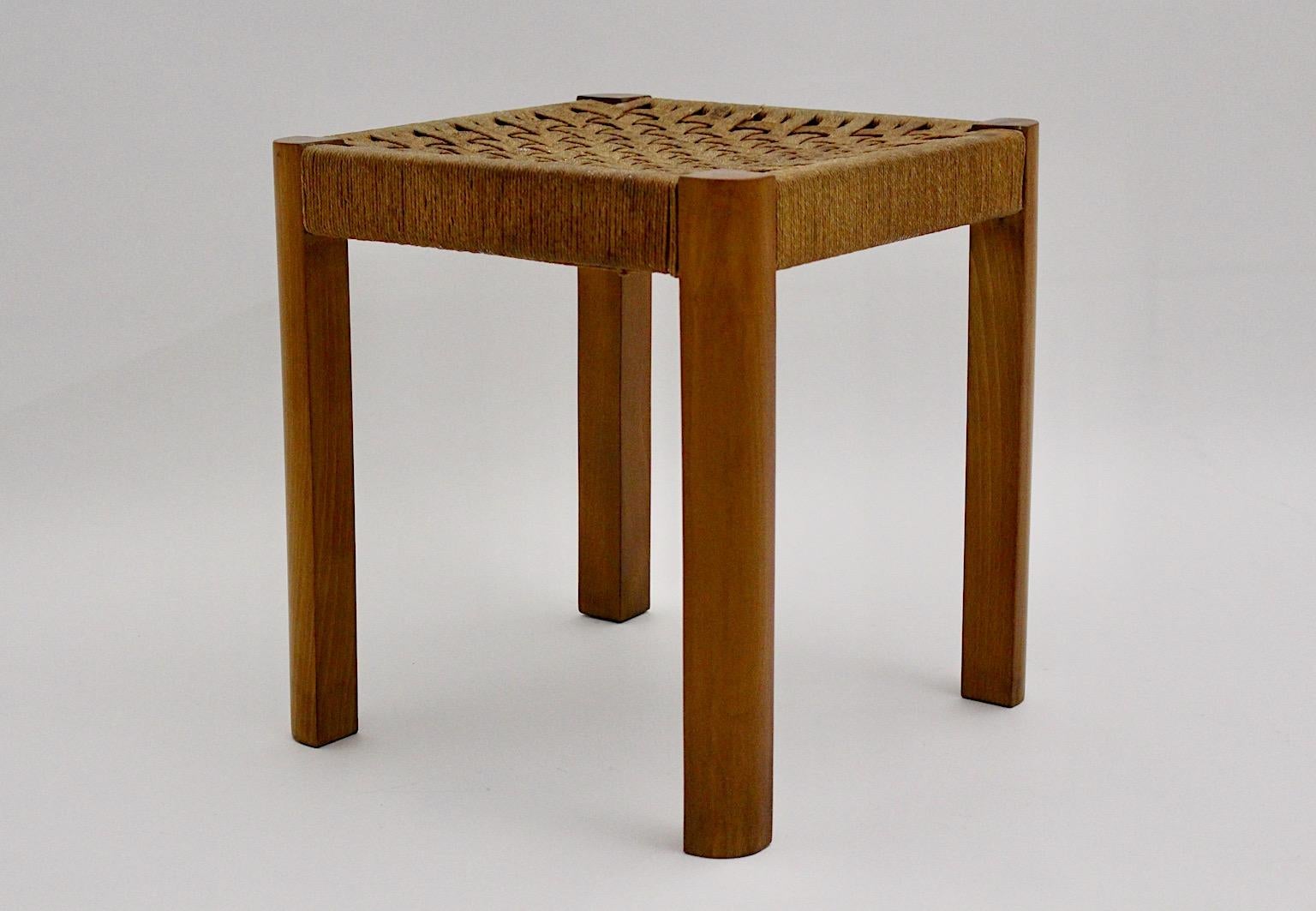 Art Deco vintage authentic stool from beech and rope bast by Josef Frank circa 1928 Austria.
The rectangular stool appears sleek and simple and throughout its bast seat chess like woven seat, the stool spreads its amazing attention to details.
The