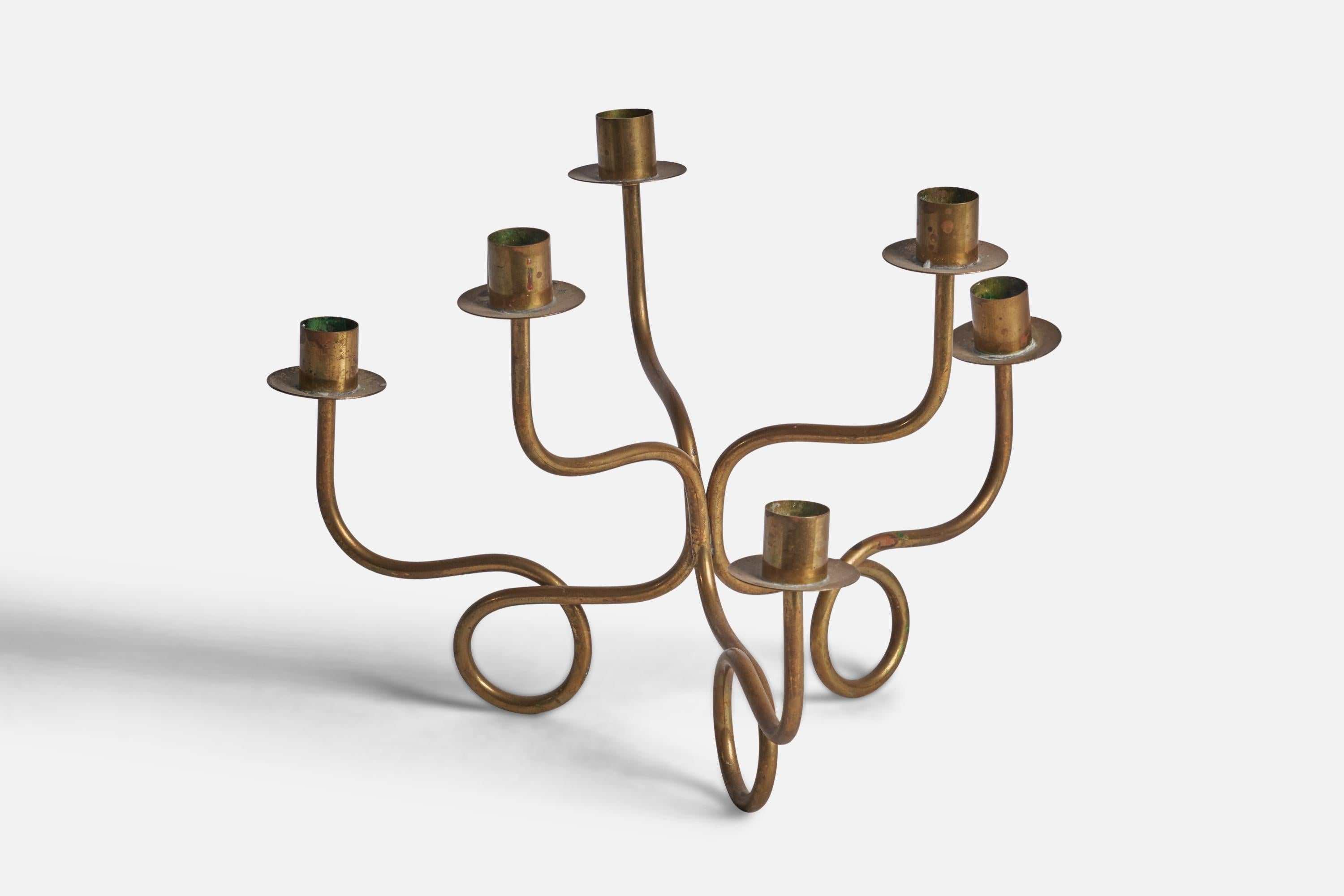 A six-armed organic brass candelabra designed by Josef Frank and produced by Svenskt Tenn, Sweden, 1940s.

Fits 0.80” diameter candles