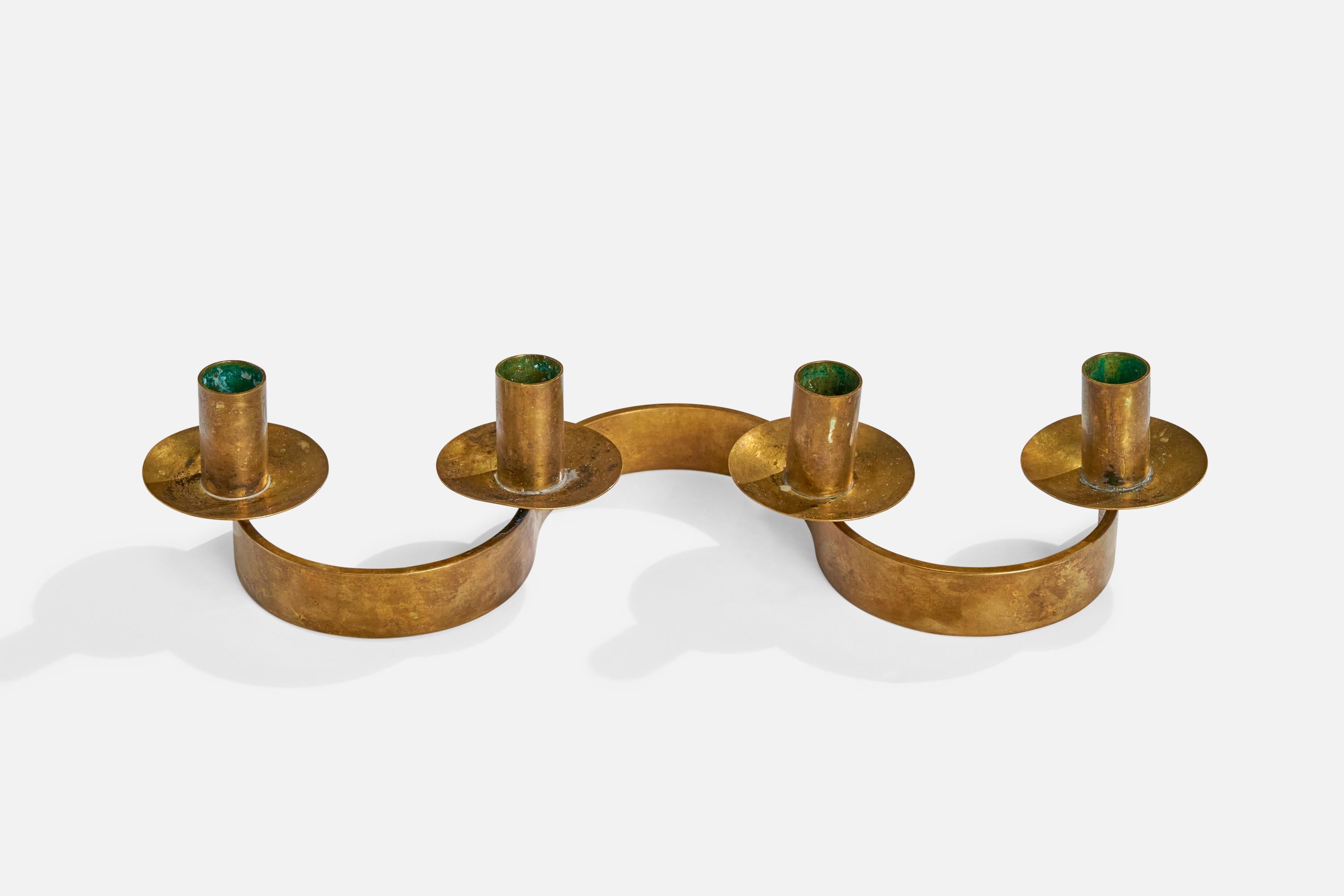 An organic brass candelabra designed by Josef Frank and produced by Svenskt Tenn, Sweden, 1940s.

Holds .75” diameter candles
