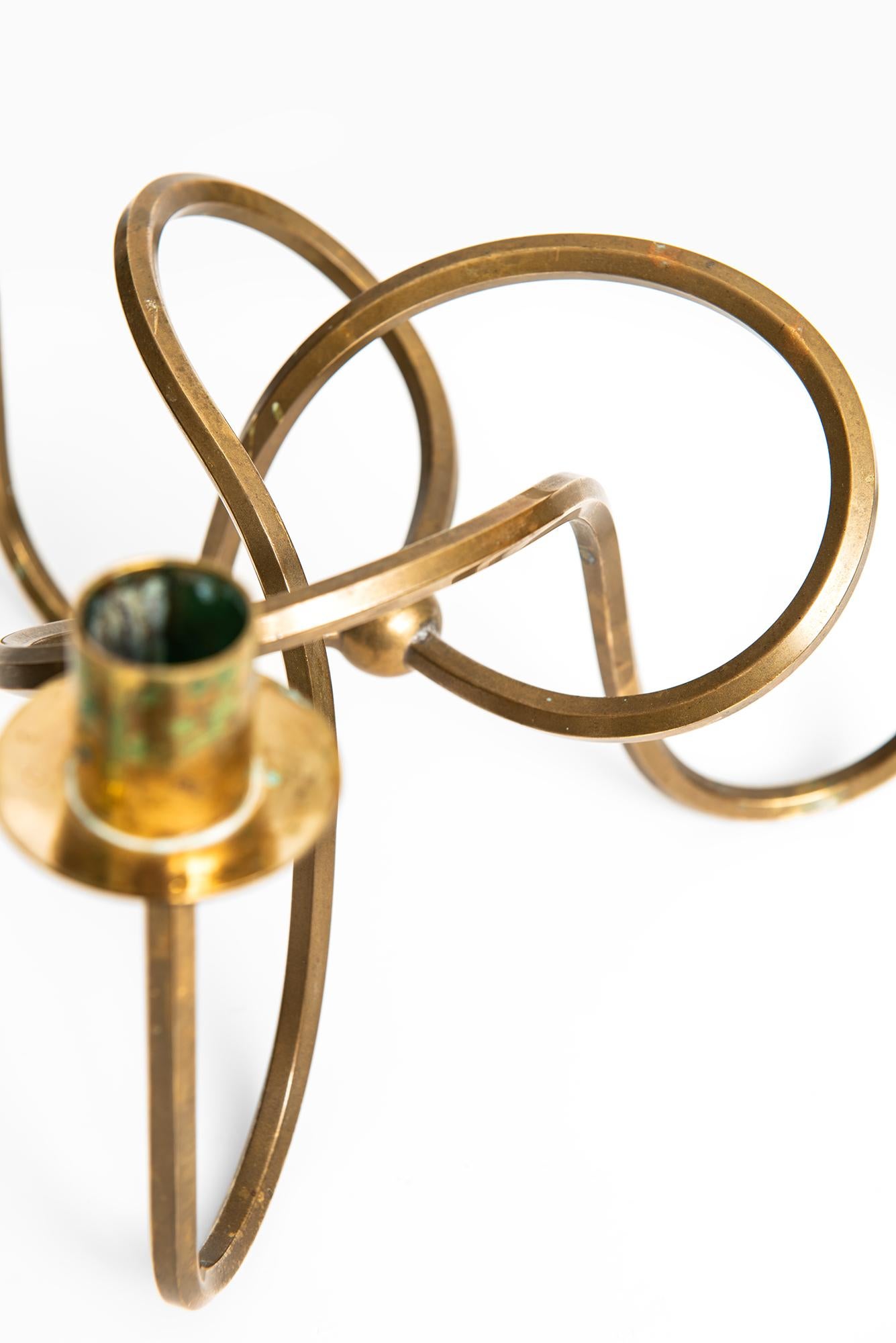 Candlestick (the knot of friendship) in brass designed by Josef Frank. Produced by Svenskt Tenn in Sweden.