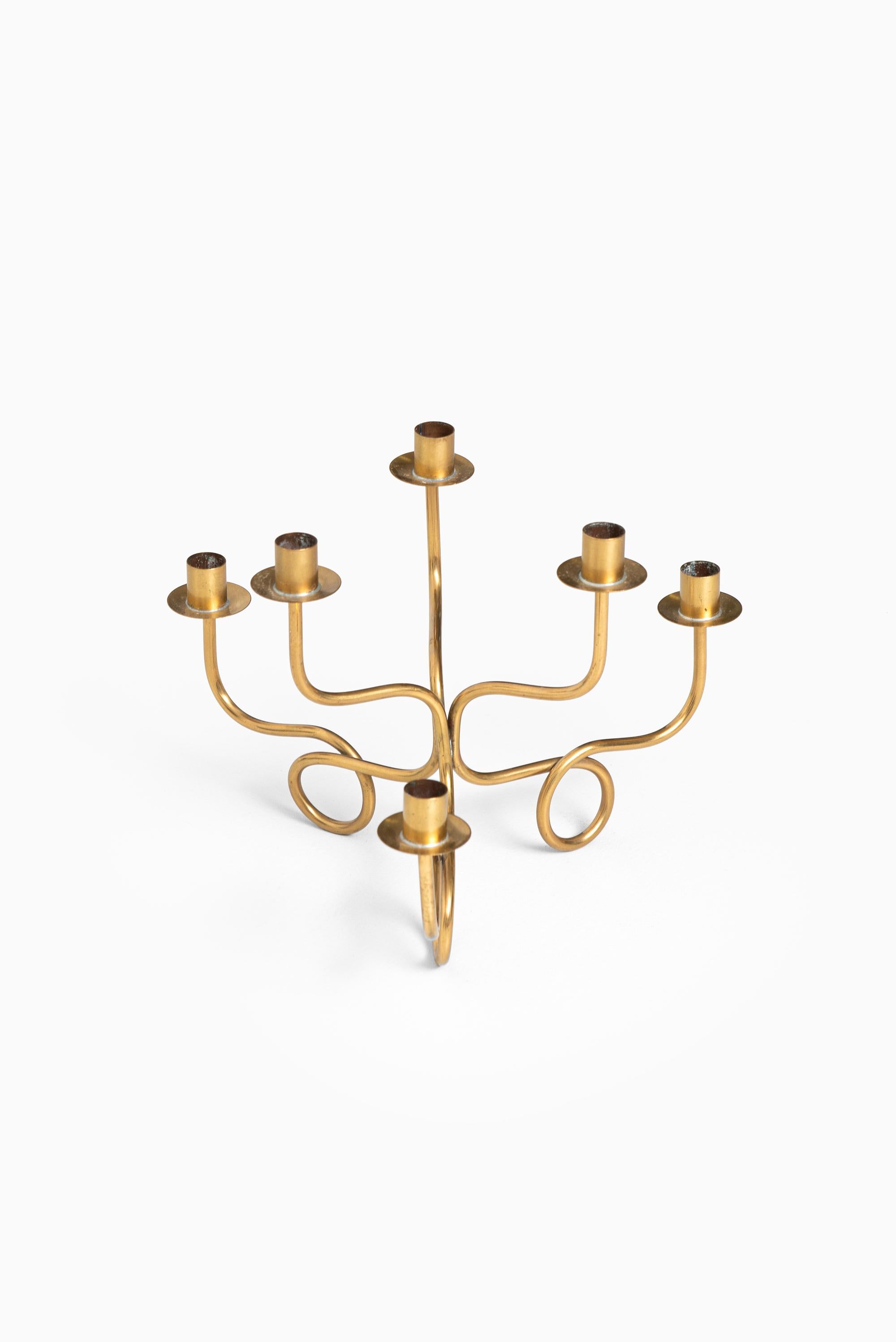 Candlestick in brass designed by Josef Frank. Produced by Svenskt tenn in Sweden.