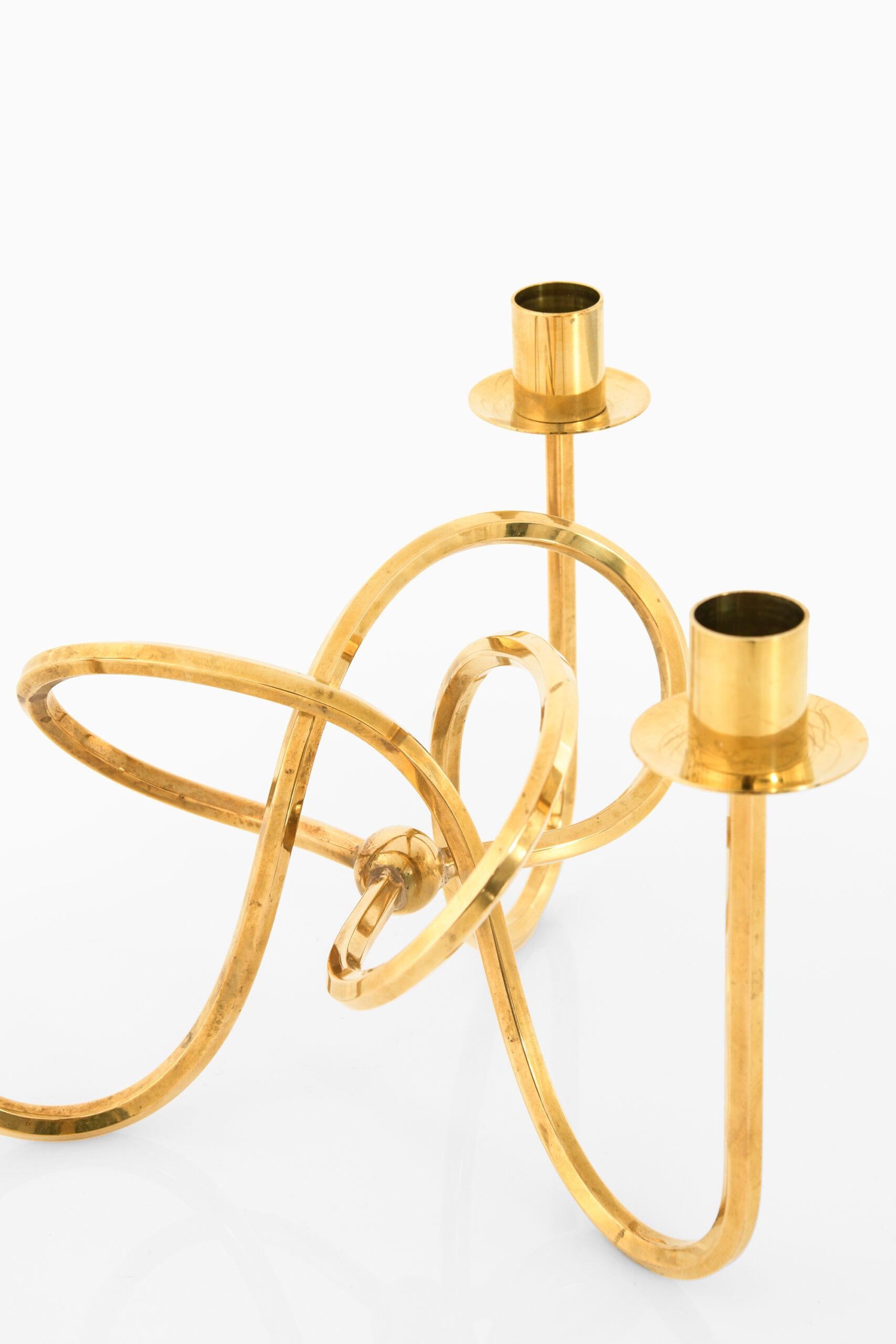 Candlestick (the knot of friendship) in brass designed by Josef Frank. Produced by Svenskt Tenn in Sweden.