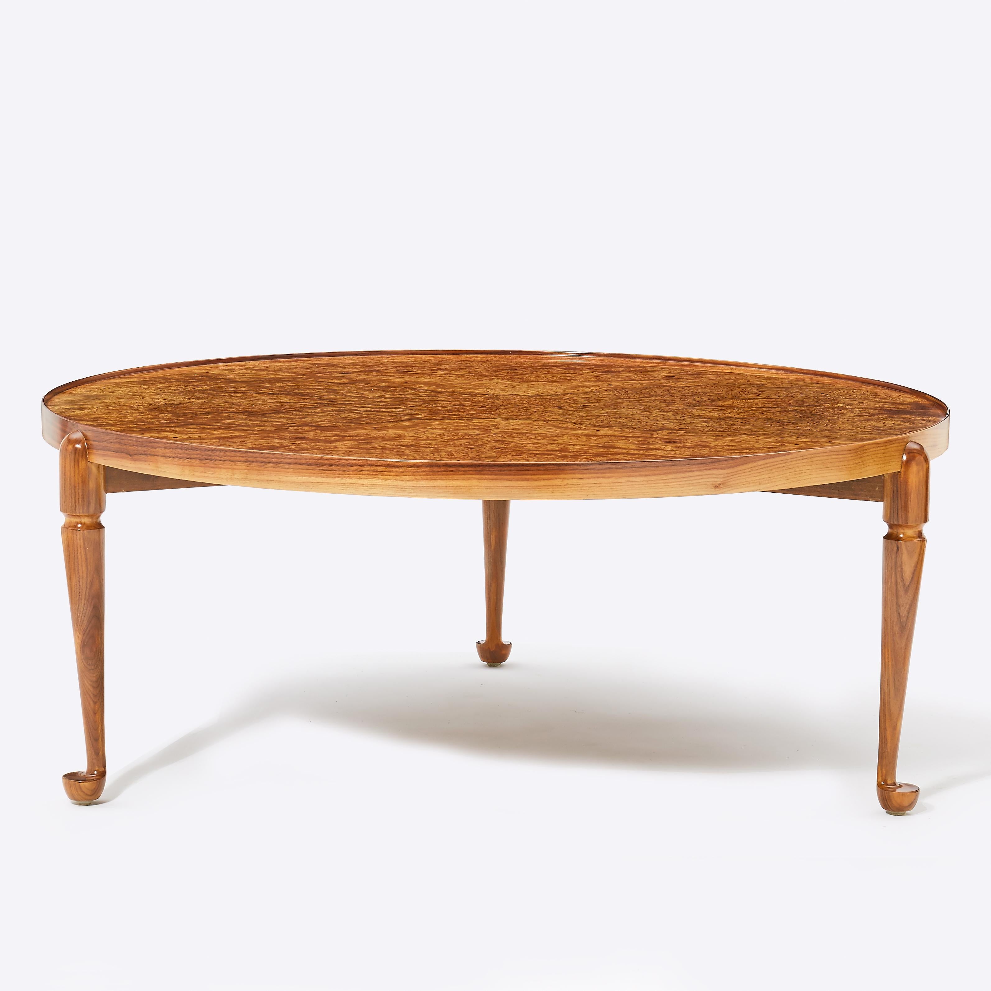 Very beautiful Josef Frank coffee table with a rare burl wood top in excellent condition. Very vibrant wood color and no fading. Originally designed in 1952, this model is from the 1980s and manufactured by Eriksson & Söners Möbelsnickeri Vrena,