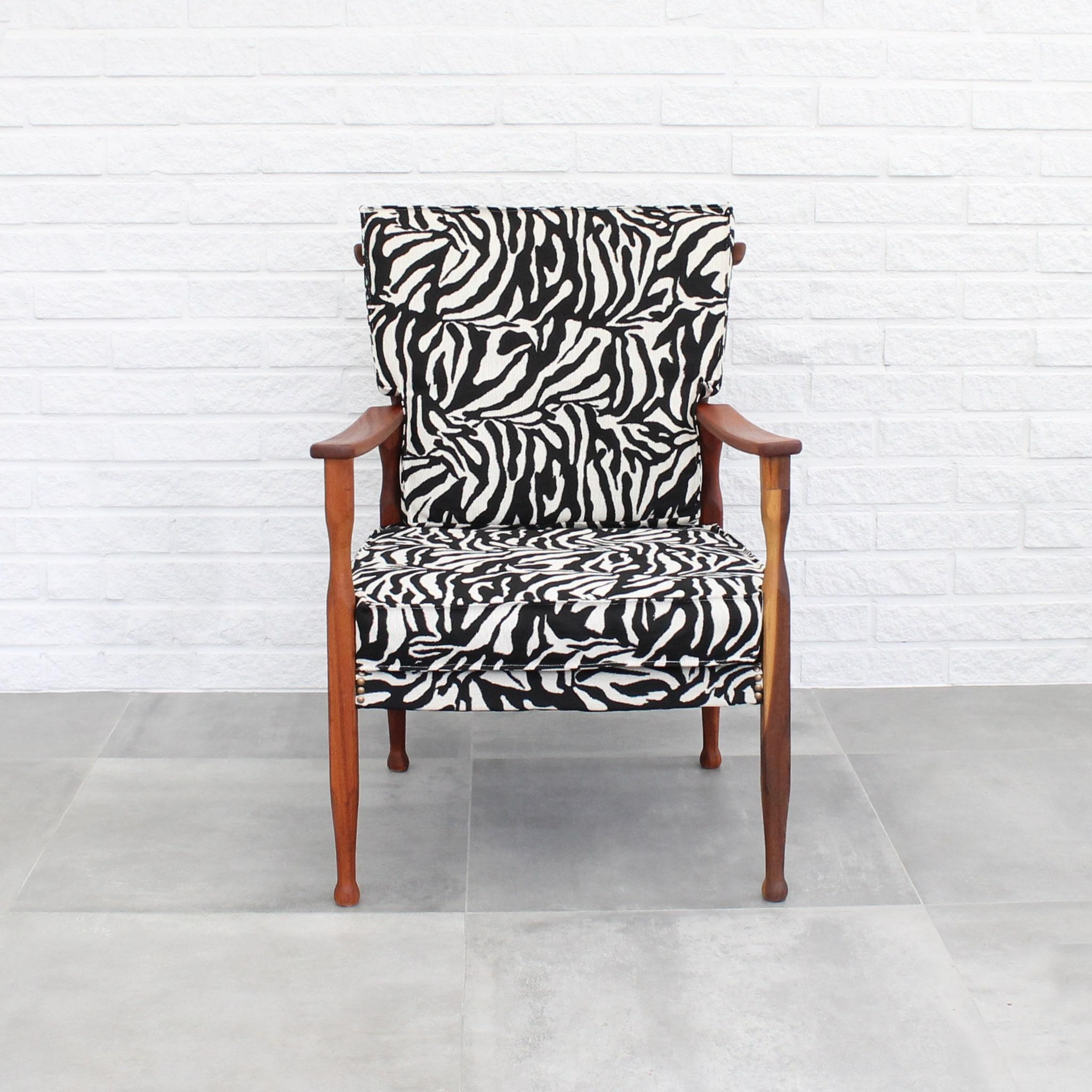Easy chair 891 designed by Josef Frank for Firma Svenskt Tenn in 1937. Made from solid mahogany, reupholstered in a striking zebra-striped textile. The Austrian architect Josef Frank, who was raised in Vienna and educated at the Konstgewerbeschule,